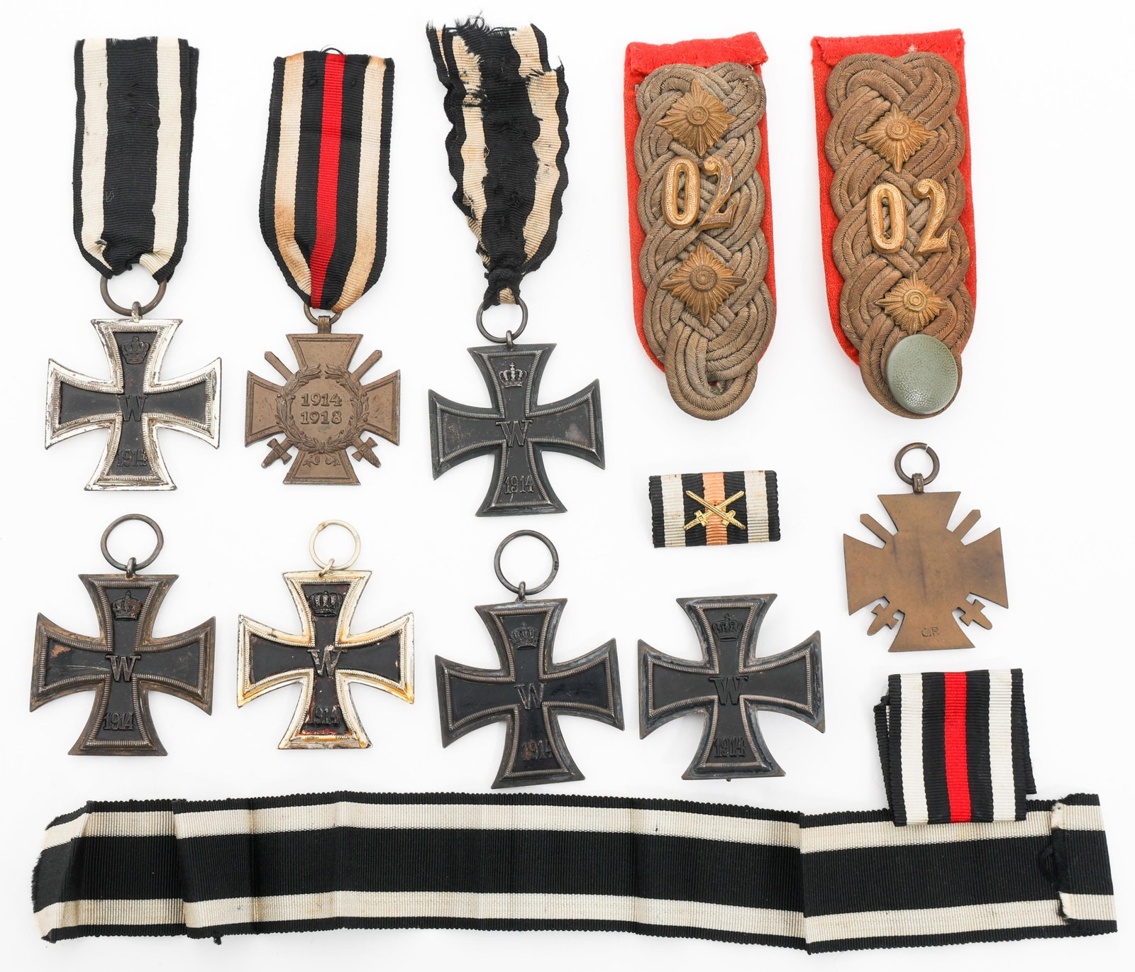 WWI GERMAN IRON CROSS AWARDS & SHOULDER BOARDS: WWI GERMAN IRON CROSS AWARDS & SHOULDER BOARDS WWI Imperial German Iron Cross Awards & Officer Shoulder Boards. (1) Iron Cross 1st Class. No visible maker mark. (5) Iron Cross 2nd Class. (1) Pair of A