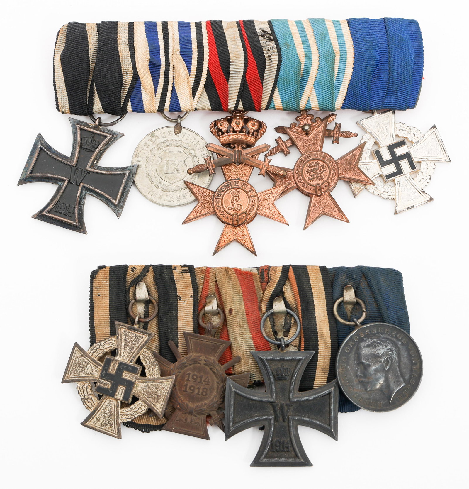 WWI - WWII GERMAN MEDAL BARS: WWI - WWII GERMAN MEDAL BARS Two WWI - WWII German Medal Bars. Includes 1914 Iron Cross 2nd Class, Bavarian Merit Crosses, Faithful Service medals, Combatant's Cross of Honor, and more