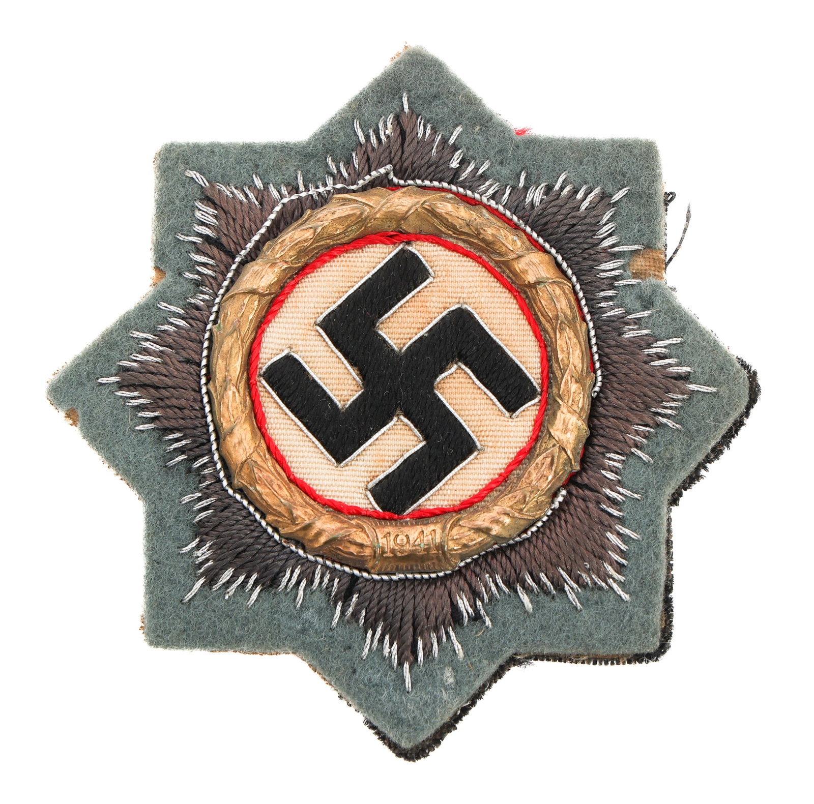 WWII GERMAN CROSS IN GOLD CLOTH BULLION EMBROIDERY: WWII GERMAN CROSS IN GOLD CLOTH BULLION EMBROIDERY WWII German Cross in Gold. Cloth version in cotton and silver thread embroidery. Cloth backing with no visible maker mark. Size: 73.1mm