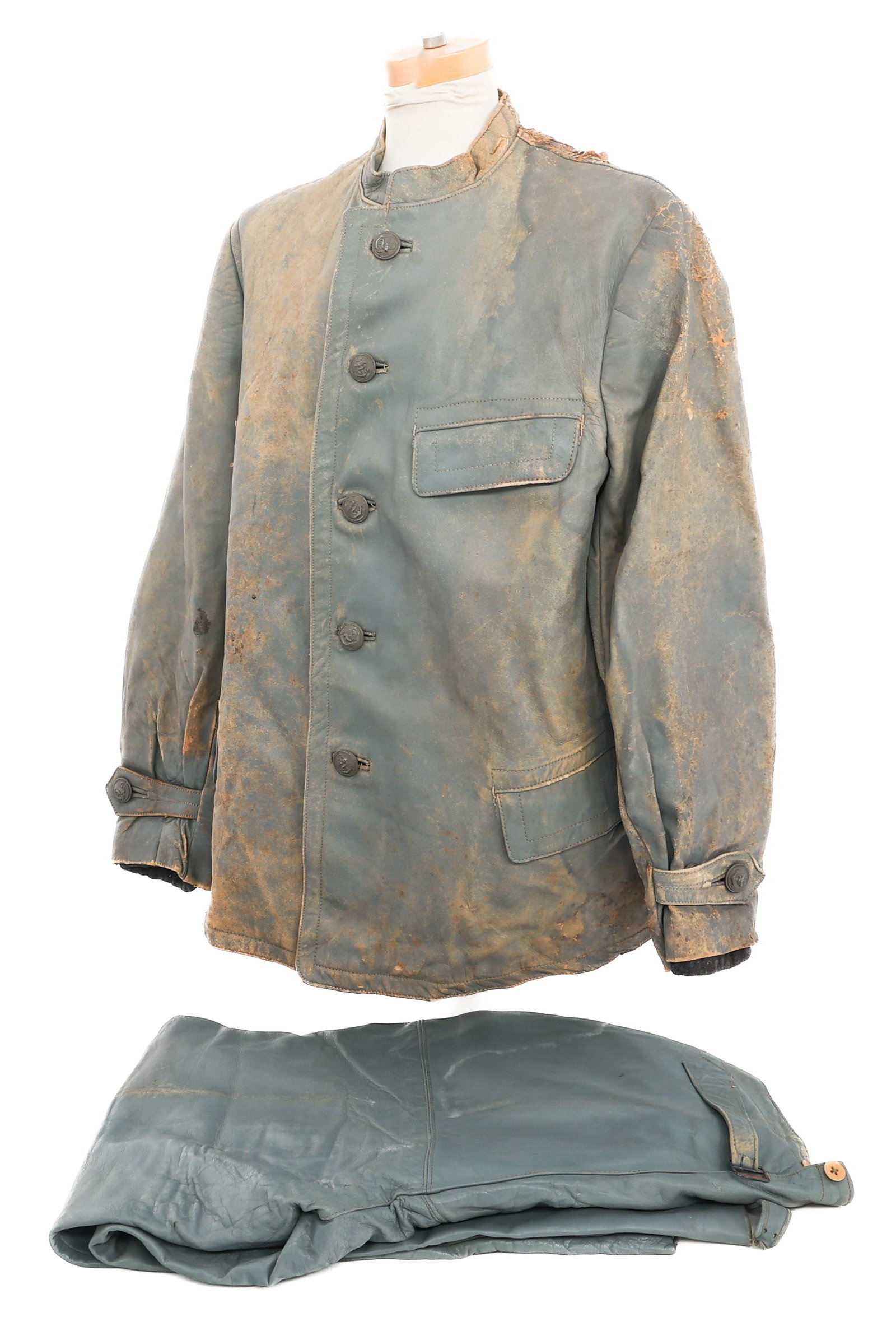 WWII GERMAN KRIEGSMARINE FOUL WEATHER UNIFORM: WWII GERMAN KRIEGSMARINE FOUL WEATHER UNIFORM WWII German Kriegsmarine Foul Weather Jacket and Pants. (1) Jacket. Grey leather construction with navy anchor buttons and wool liner. Maker tag present. 