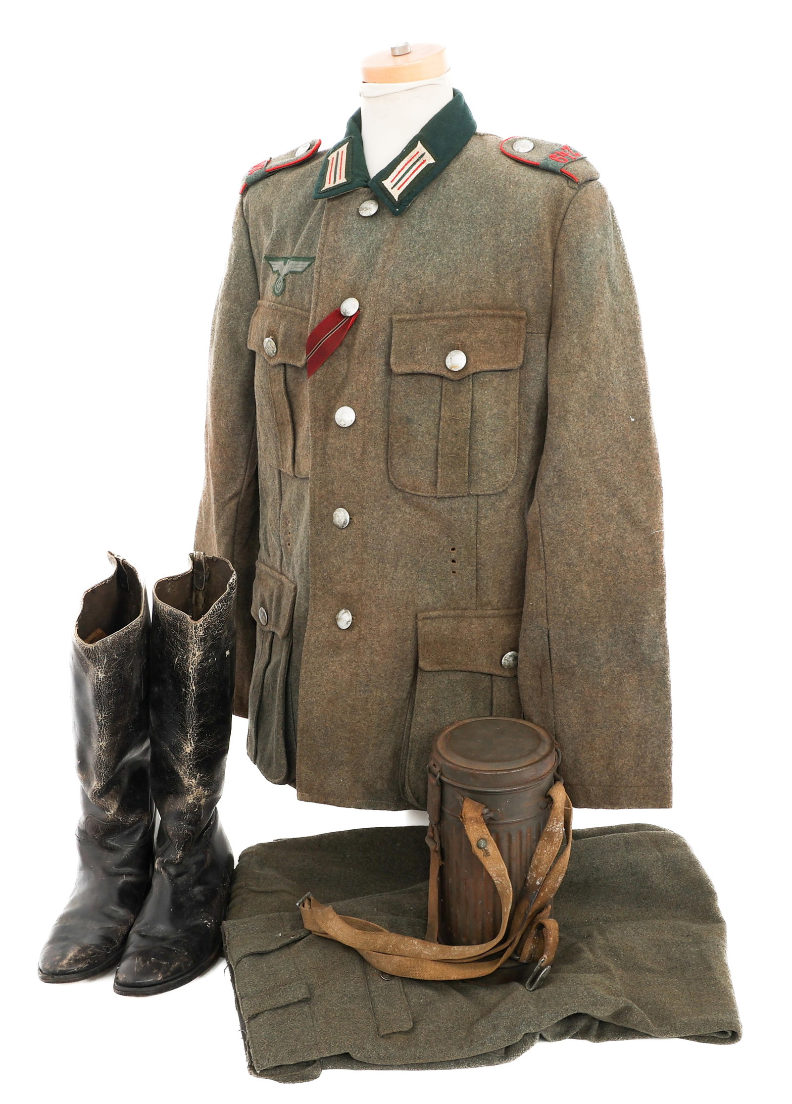 WWII GERMAN 647th ARTILLERY REGT ENLISTED UNIFORM: WWII GERMAN 647th ARTILLERY REGT ENLISTED UNIFORM WWII German Heer 647th Artillery Regiment Enlisted Man Uniform and Gas Mask. (1) Heer M35 Tunic. Fine wool construction. Enlisted Man collar tabs and 