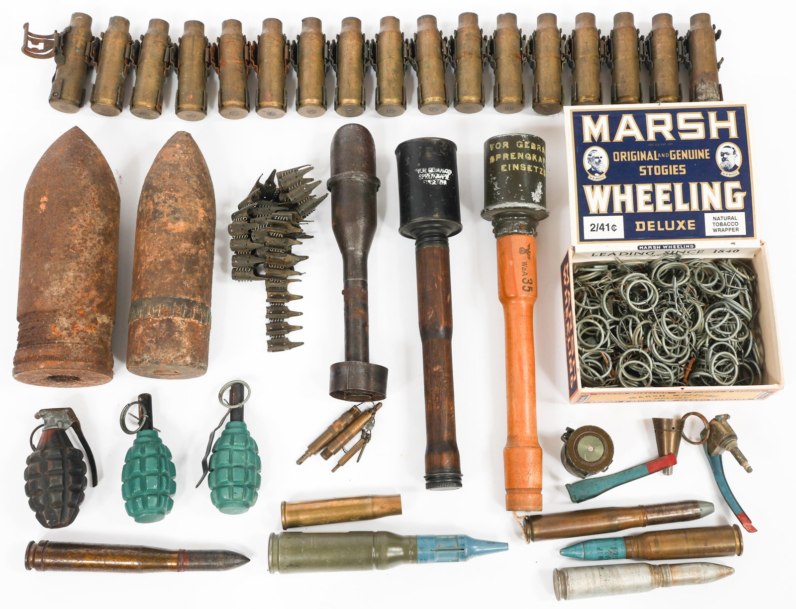WWI - COLD WAR WORLD MILITARY ORDNANCE: WWI - COLD WAR WORLD MILITARY ORDNANCE WWI - Cold War World Military Ordnance. Includes German stick grenades, WWI Artillery projectiles, 25mm training rounds, German MG42 ammo belt, US rifle grenade,