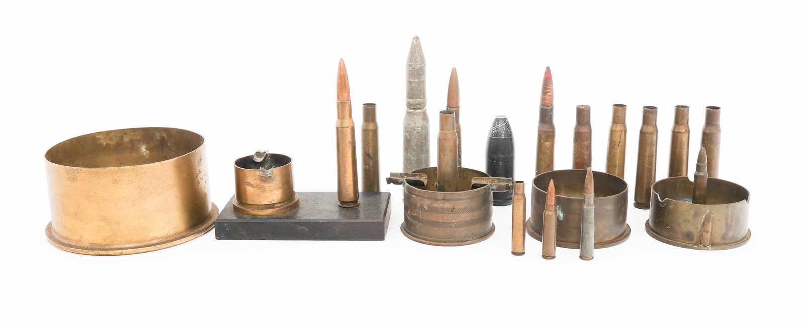 WWI - WWII WORLD MILITARY TRENCH ART & SHELLS: WWI - WWII WORLD MILITARY TRENCH ART & SHELLS WWI - WWII World Military Ash Tray Trench Art & Shell Casings. Includes .30 cal, .50 cal, 20mm and more.