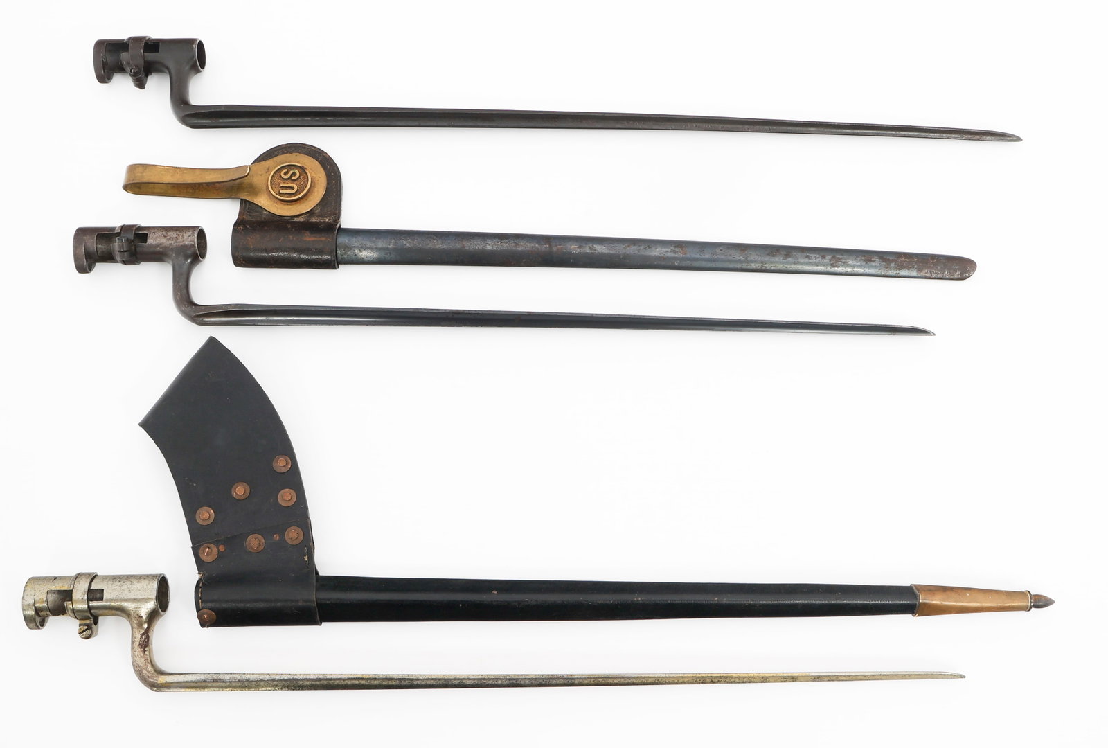 19th C. US ARMY & SPANISH SOCKET BAYONETS: 19th C. US ARMY & SPANISH SOCKET BAYONETS 19th C. US Army & Spanish Socket Bayonets. (1) US M1855. Triangular blade with fuller. "US" stamped on the ricasso. Leather scabbard with brass fitting. (1) U