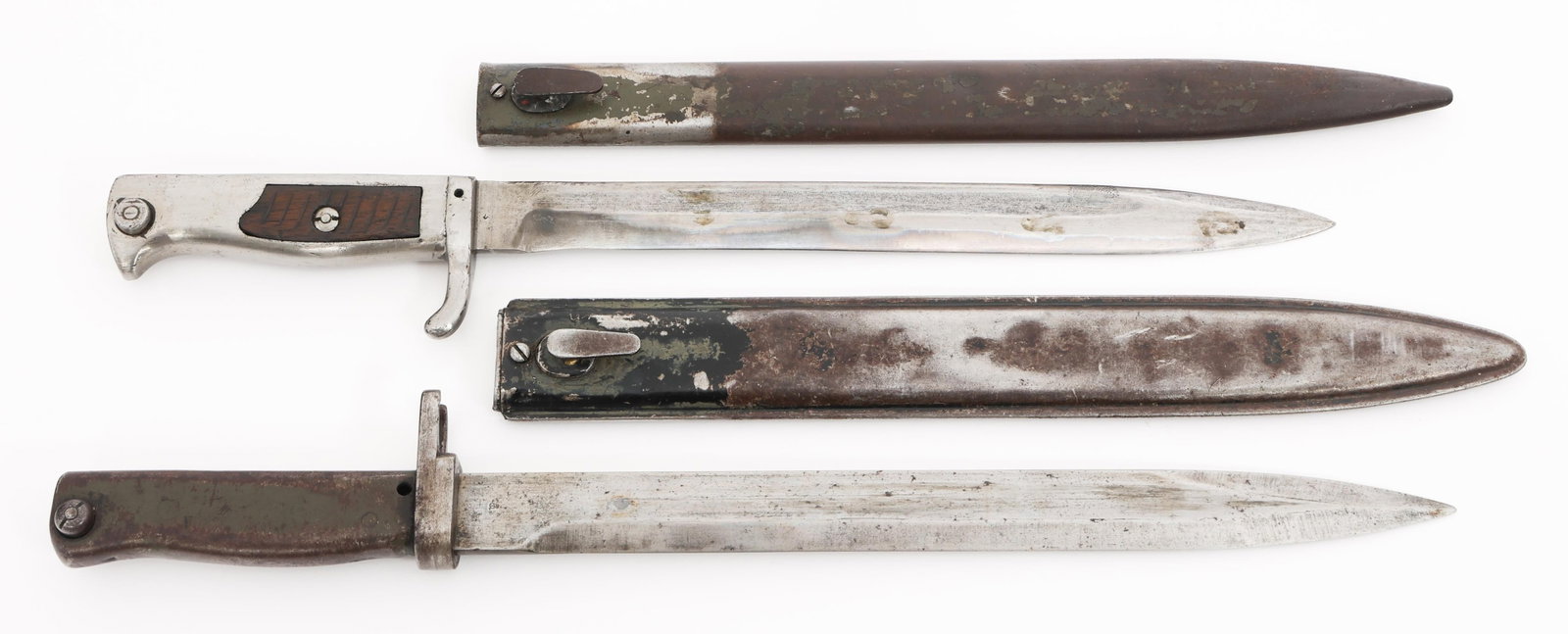 WWI GERMAN ERSATZ BAYONETS: WWI GERMAN ERSATZ BAYONETS WWI German Ersatz Bayonets. Single edged, bright blades. No visible marks. One green painted steel hilt, one steel hilt with wood grips. Steel scabbards. Blade Length: 11 1/