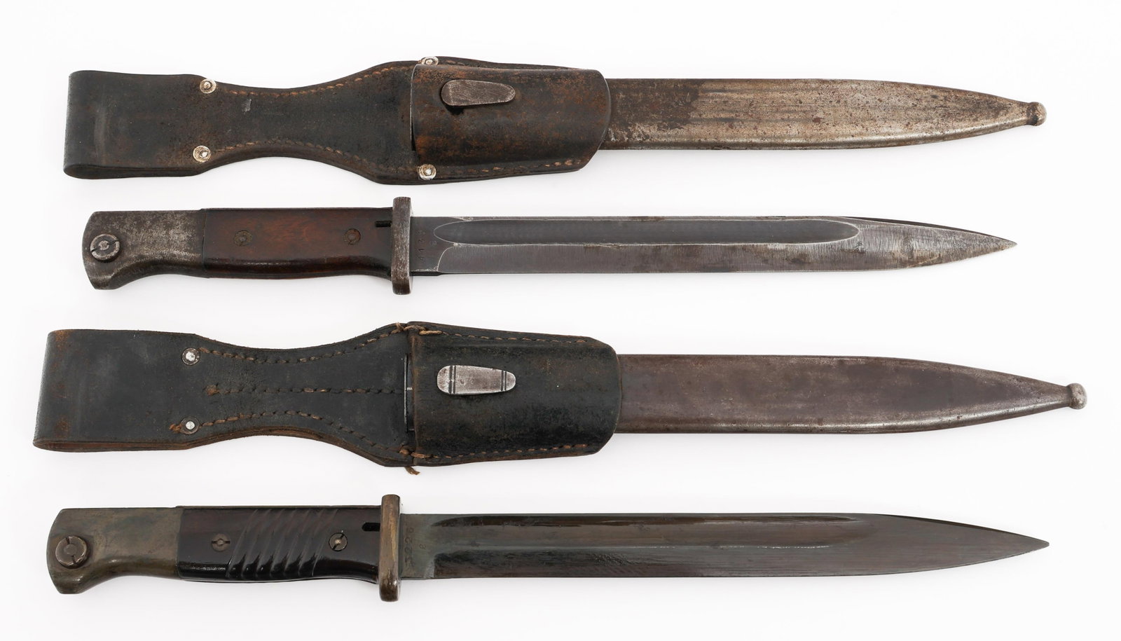 WWII GERMAN K98 COMBAT BAYONETS: WWII GERMAN K98 COMBAT BAYONETS WWII German K98 Combat Bayonets. (1) Combat K98. Maker marked "cof43" on one side of the ricasso, serial numbered 4130 on the reverse. Steel hilt with wood grips. Steel