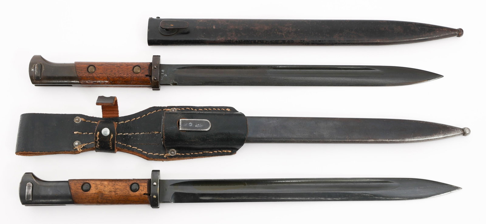WWII GERMAN S24 BAYONETS WITH SCABBARDS: WWII GERMAN S24 BAYONETS WITH SCABBARDS Two WWII German Occupied Czech S24 Bayonets with Scabbards. (1) S24 Bayonet. Single edged, blued blade with fuller. Waffenamt stamp on one side of the ricasso a