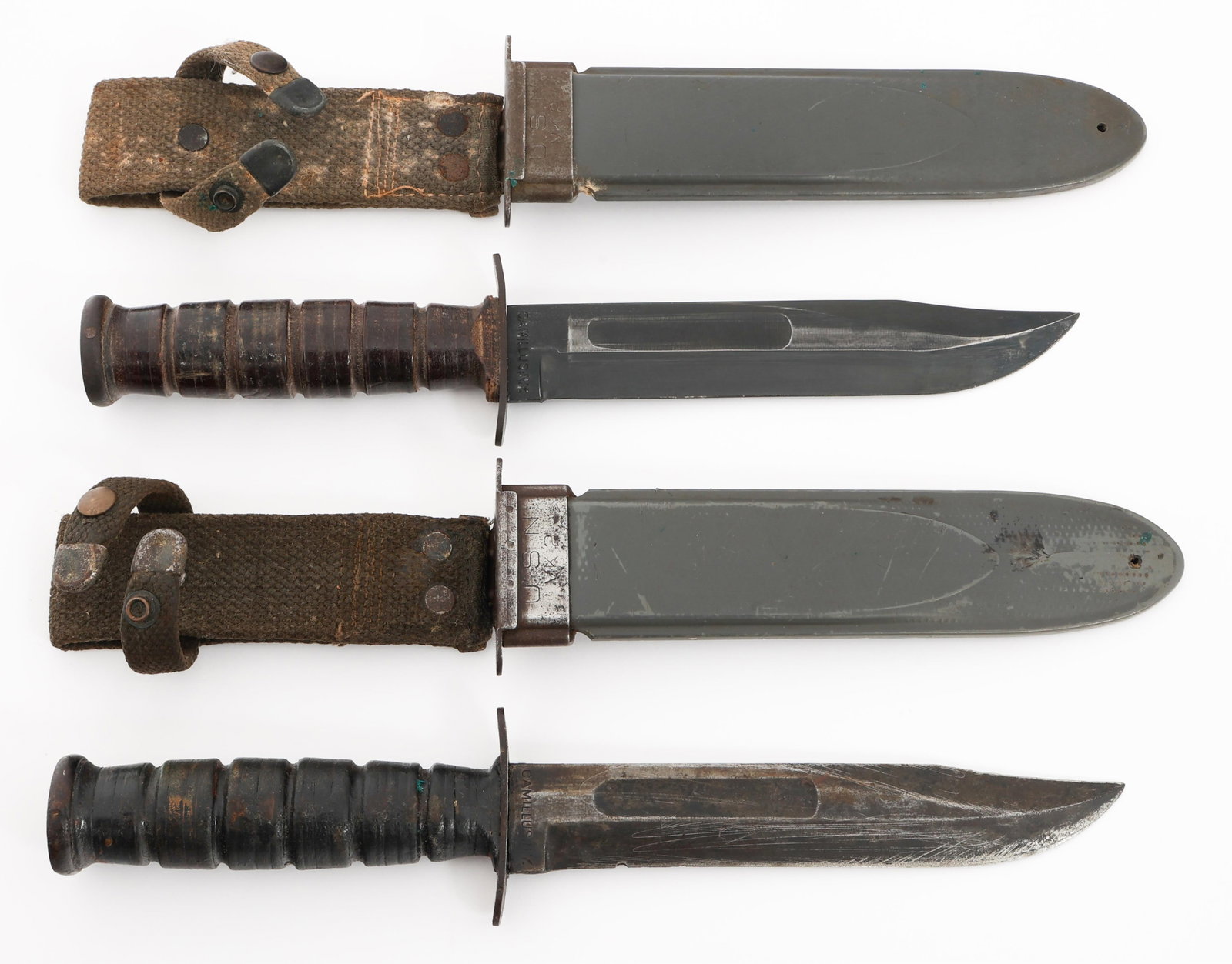 WWII US NAVY MARK 2 FIGHTING KNIVES By CAMILLUS: WWII US NAVY MARK 2 FIGHTING KNIVES By CAMILLUS Two WWII US Navy Mark 2 Fighting Knives. Single edged, clip-point blades with fuller. Maker marked by Camillus, N.Y. and "U.S.N. Mark 2" stamped on the 