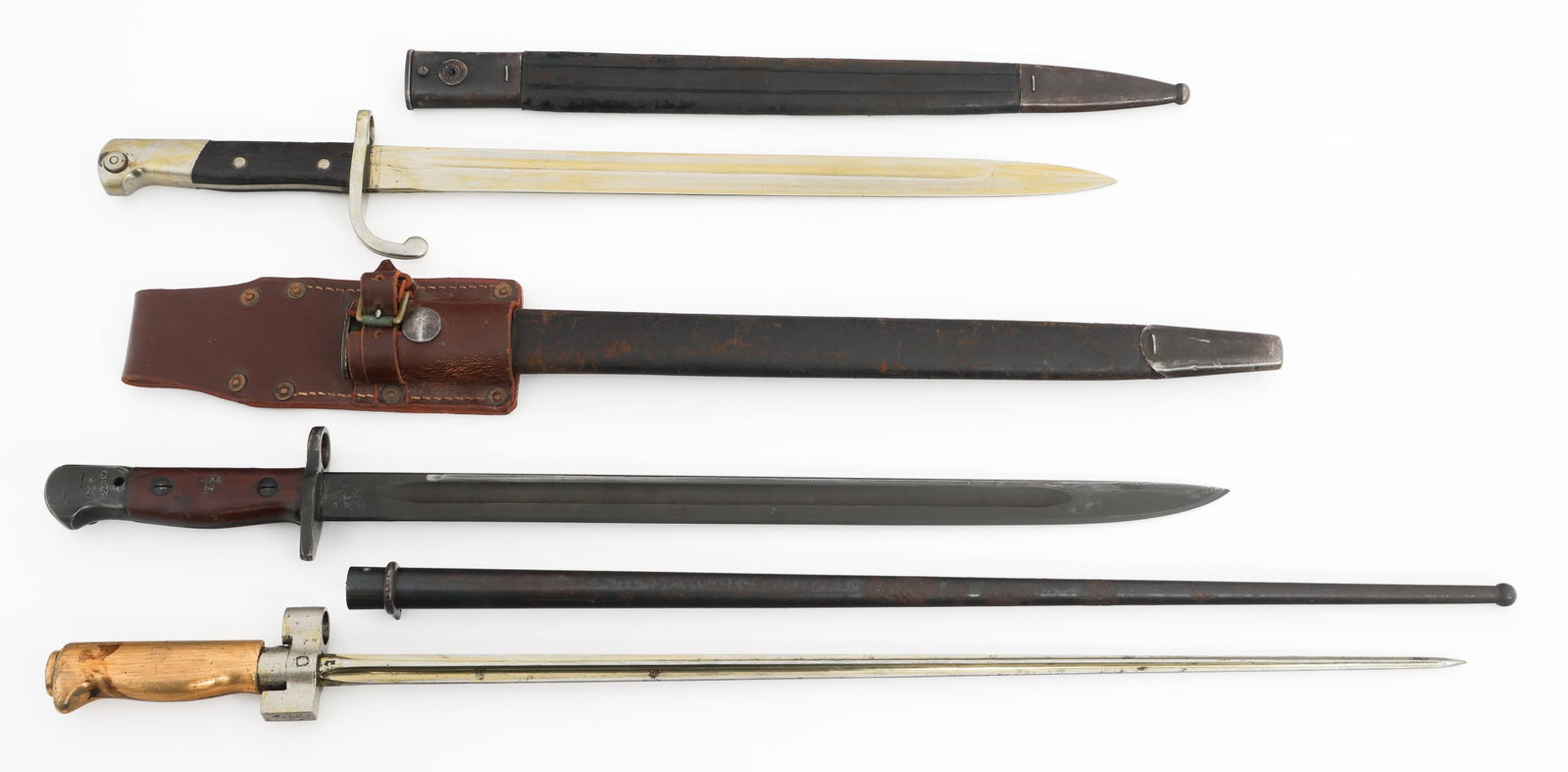 19th C. - WWII WORLD MILITARY BAYONETS: 19th C. - WWII WORLD MILITARY BAYONETS 19th C. - WWII French, Brazilian, and Australian Bayonets. (1) French M1886. "M.P." stamped near the hilt. Serial number on the crossguard. Steel scabbard. (1) B