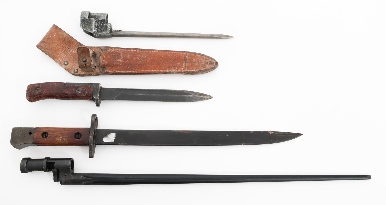 WWII - COLD WAR WORLD MILITARY BAYONETS: WWII - COLD WAR WORLD MILITARY BAYONETS WWII - Cold War World Military Bayonets. (1) Mosin Nagant Socket Bayonet. Serial number etched near the socket. (1) British No. 4 Mk. III Spike Bayonet. No visi