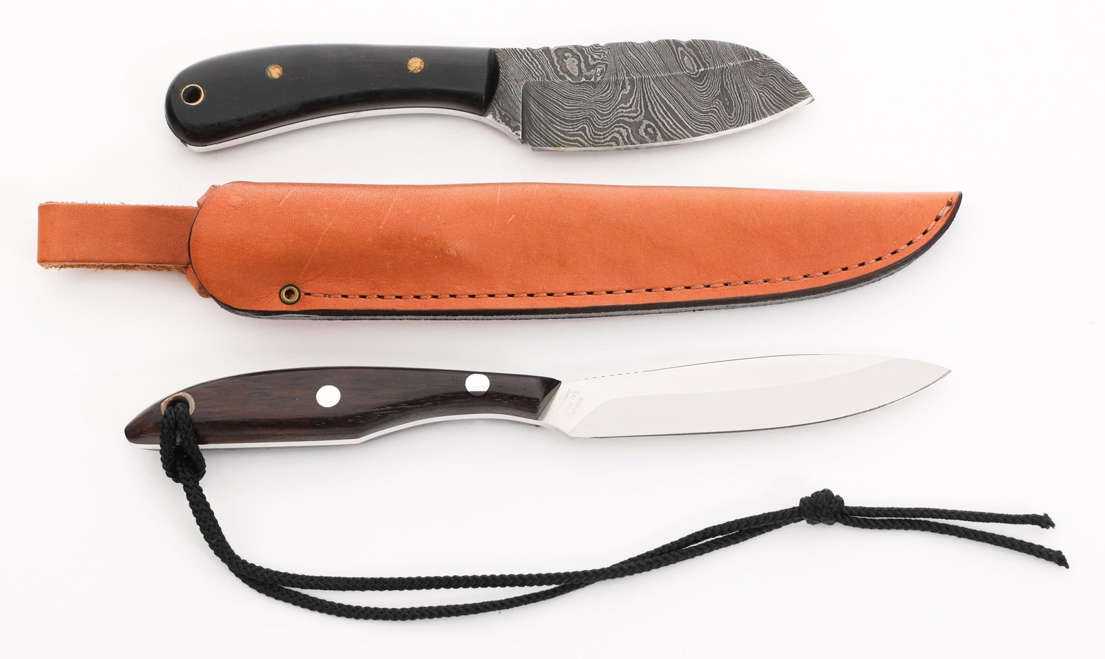 DH RUSSELL & ETCHED DAMASCUS KNIVES: DH RUSSELL & ETCHED DAMASCUS KNIVES DH Russell & Etched Damascus Knives. (1) DH Russell Grohmann Full Tang Canadian Belt Knife. Single edged, bright, stainless steel blade with thumb notches. Maker ma