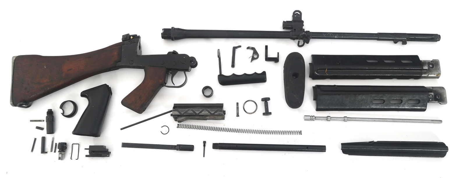 BRITISH L1A1 SLR 7.62x51mm MACHINE GUN PARTS KIT: BRITISH L1A1 SLR 7.62x51mm MACHINE GUN PARTS KIT British L1A1 SLR 7.62x51mm parts kit. Stock with lower receiver and trigger assembly. Barrel with gas block. Composite handguards and small parts. Cali