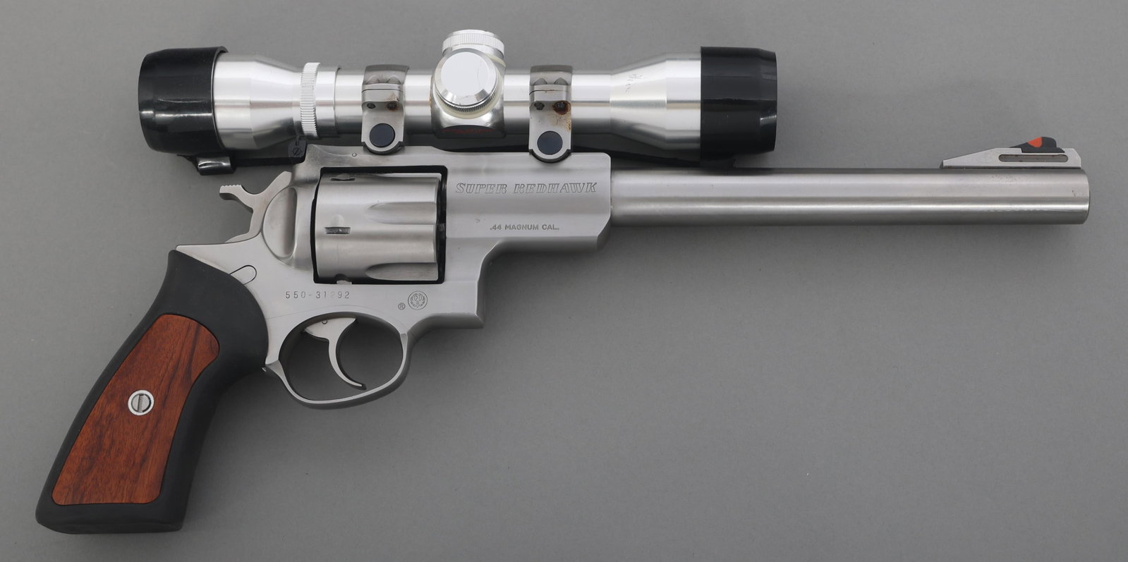 RUGER MODEL SUPER REDHAWK .44 MAG CAL REVOLVER: RUGER MODEL SUPER REDHAWK .44 MAG CAL REVOLVER Ruger Model Super Redhawk .44 Magnum caliber DA revolver. Six-shot fluted cylinder. Rubber grips with wood inserts. Blade front sight. Adjustable rear si