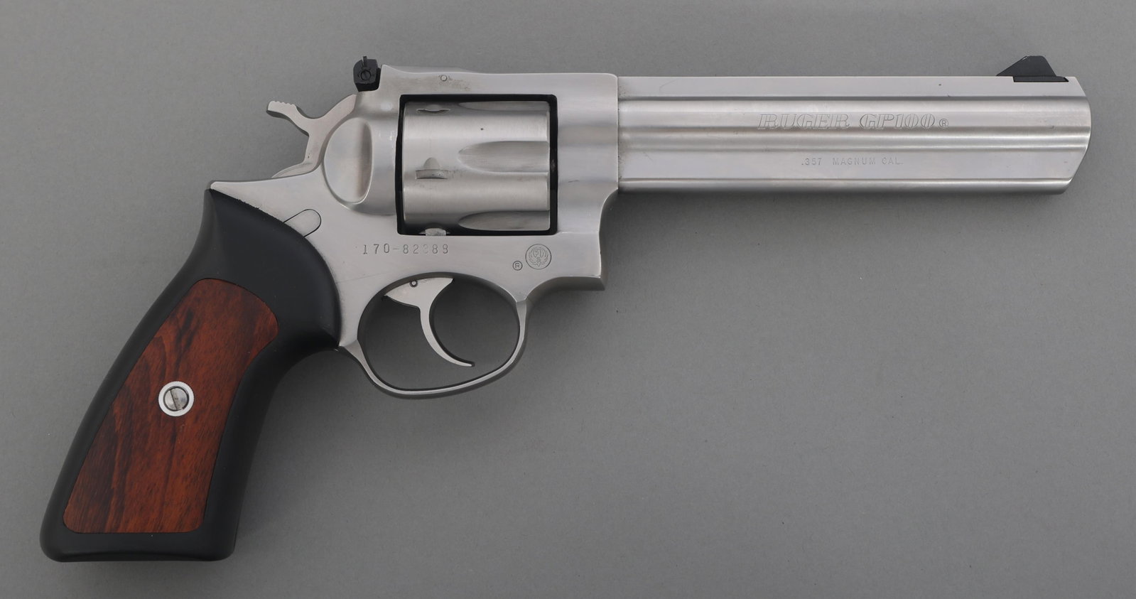 RUGER MODEL GP100 .357 MAGNUM CAL DA REVOLVER: RUGER MODEL GP100 .357 MAGNUM CAL DA REVOLVER Ruger Model GP100 .357 MAG caliber double action revolver. Stainless steel. Rubber grips with wood inserts. Adjustable rear sight. Full lug, full rib barr