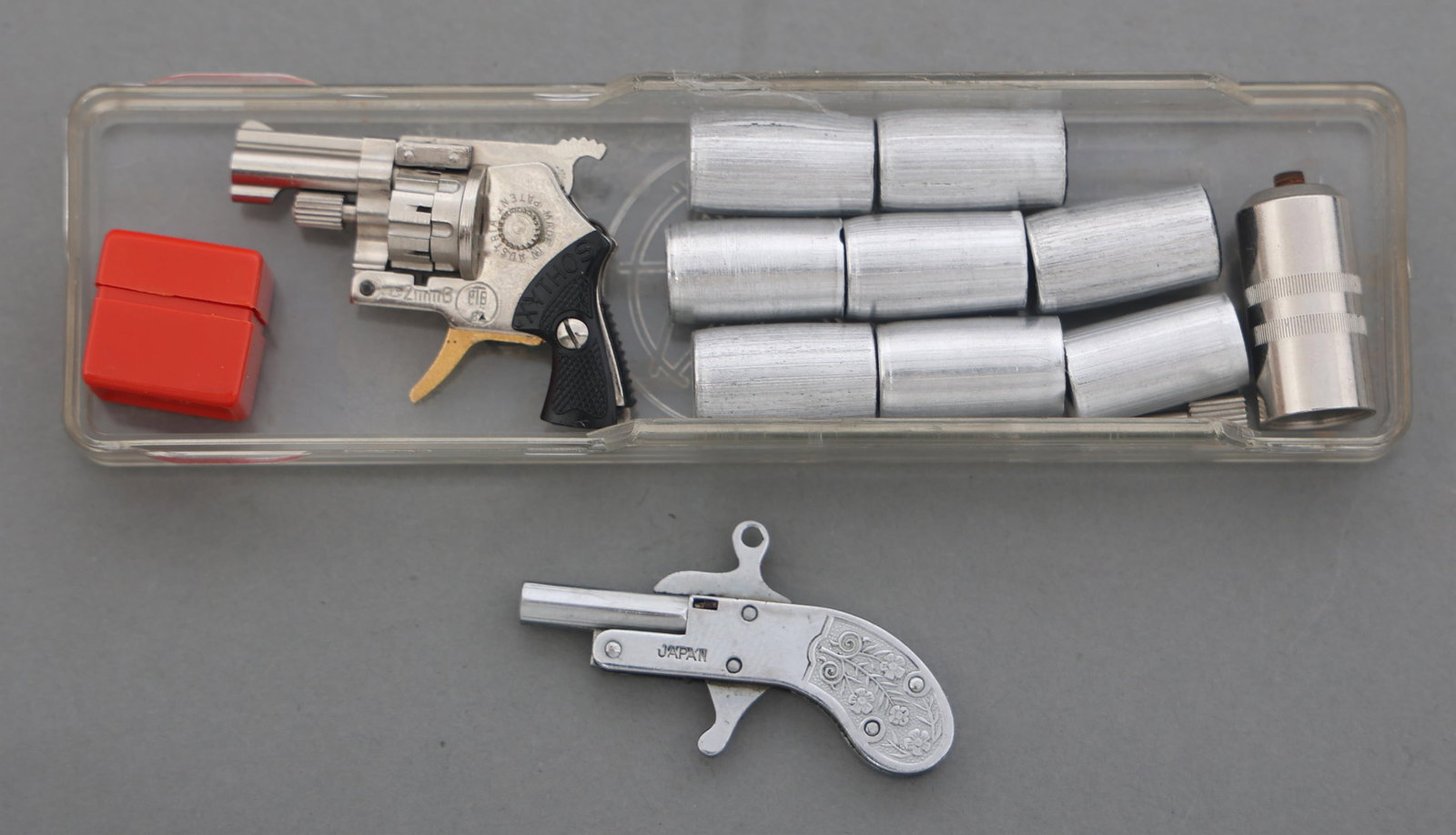 XYTHOS MINI PIN FIRE 2mm CALIBER FLARE PISTOL KIT: XYTHOS MINI PIN FIRE 2mm CALIBER FLARE PISTOL KIT Xythos miniature pin-fire 2mm caliber flare pistol kit. Xythos miniature seven-shot revolver. Barrel attachment. Eight flares. Pin-fire caps. Plastic 