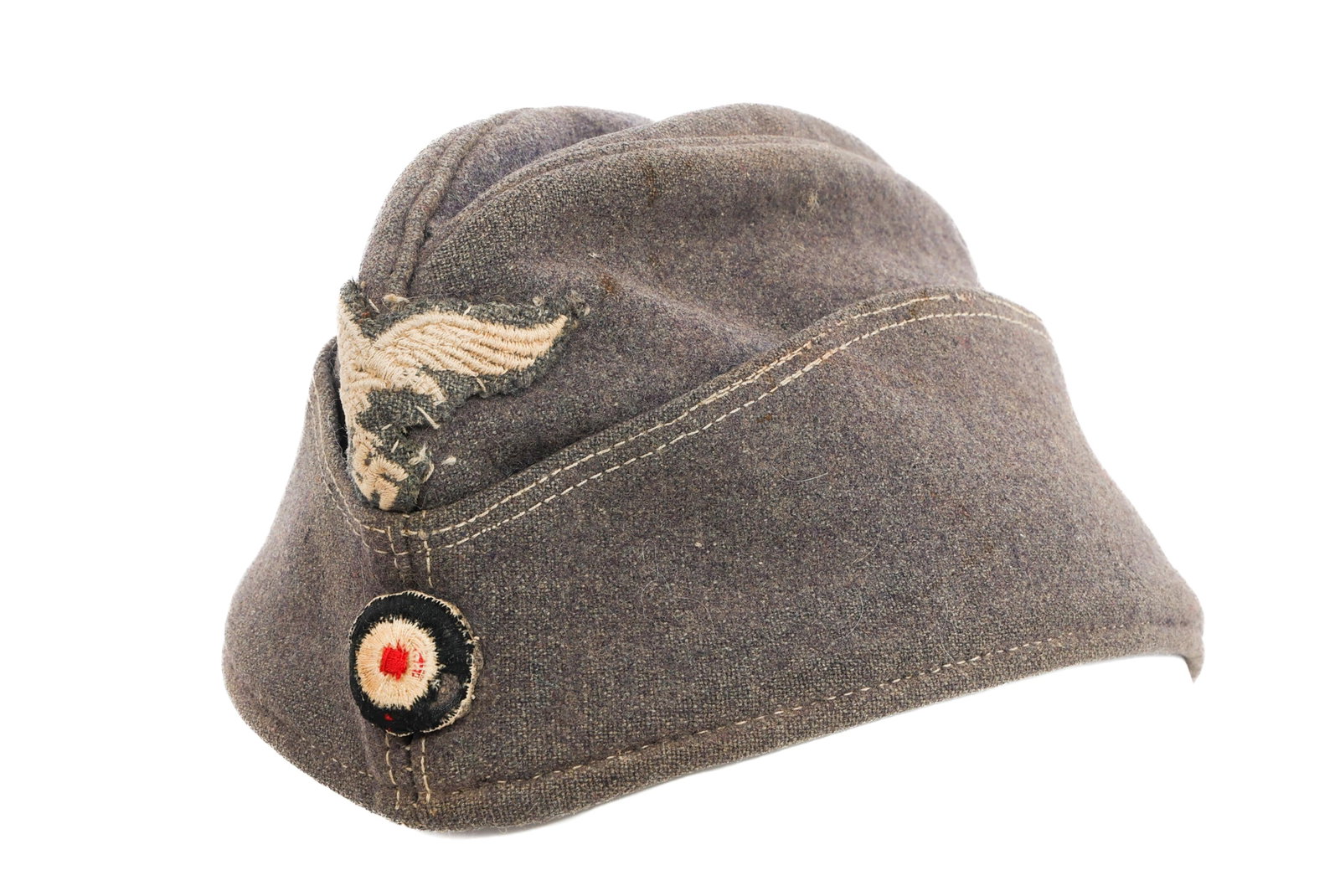 WWII GERMAN LUFTWAFFE OVERSEAS CAP: WWII GERMAN LUFTWAFFE OVERSEAS CAP WWII German Luftwaffe Overseas Cap. Grey/blue wool construction. Luftwaffe eagle and national cockade patches. Ink stamps present (heavily faded).