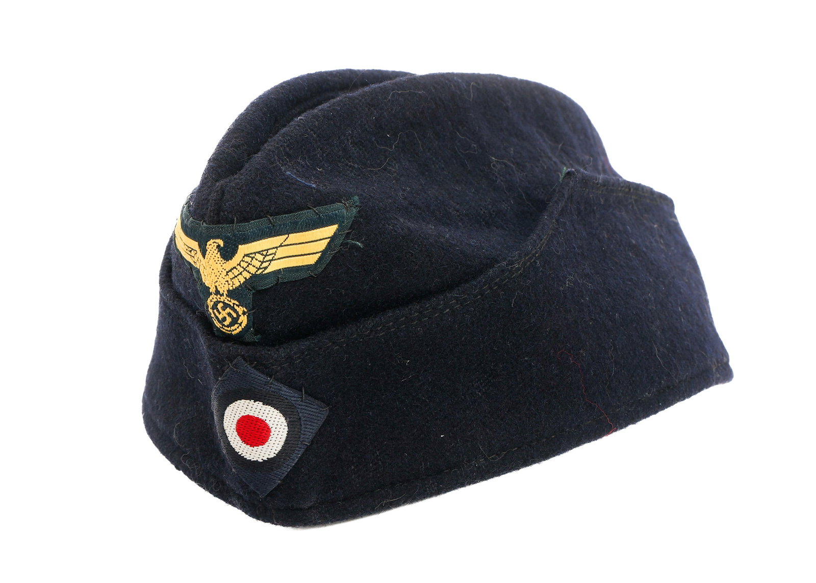 WWII GERMAN KRIEGSMARINE OVERSEAS CAP: WWII GERMAN KRIEGSMARINE OVERSEAS CAP WWII German Kriegsmarine Overseas Cap. Dark blue wool construction. Kriegsmarine eagle and national cockade patches. No visible marks.