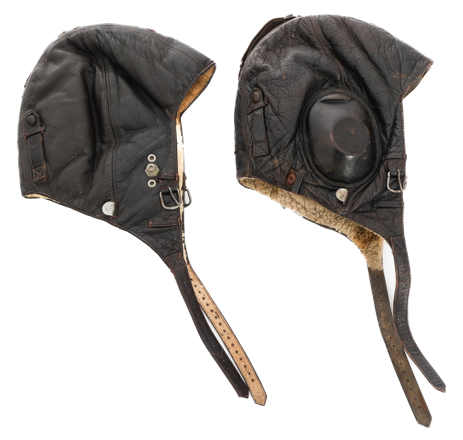 WWII GERMAN LUFTWAFFE LKpW101 & FK33 HELMETS: WWII GERMAN LUFTWAFFE LKpW101 & FK33 HELMETS WWII German Luftwaffe LKpW101 & FK33 Leather Flight Helmets. (1) LKpW101. Maker marked by Luftfahrt-Geratwerk, Hakenfelde. No visible size. (1) FK33. RN nu