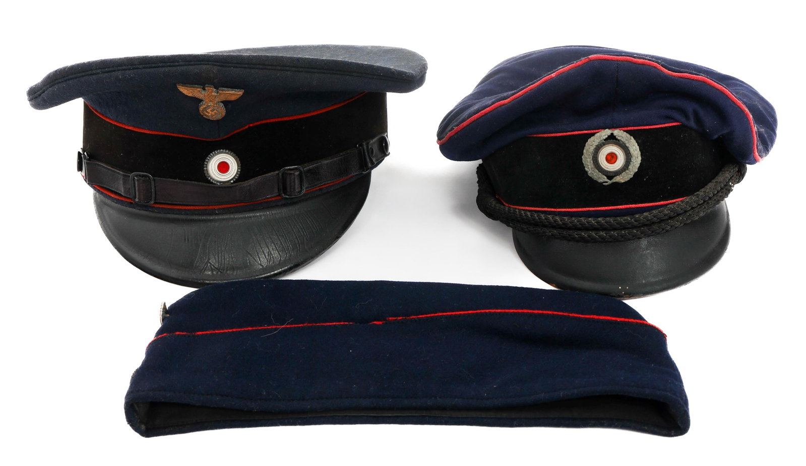 WWII GERMAN FIRE POLICE & REICHSBAHN CAPS: WWII GERMAN FIRE POLICE & REICHSBAHN CAPS WWII German Fire Police and Reichsbahn Caps. (1) Fire Police Officer Visor Cap. "57" stamped on the inside. (1) Enlisted Reichsbahn Visor Cap. Tailor tag pres