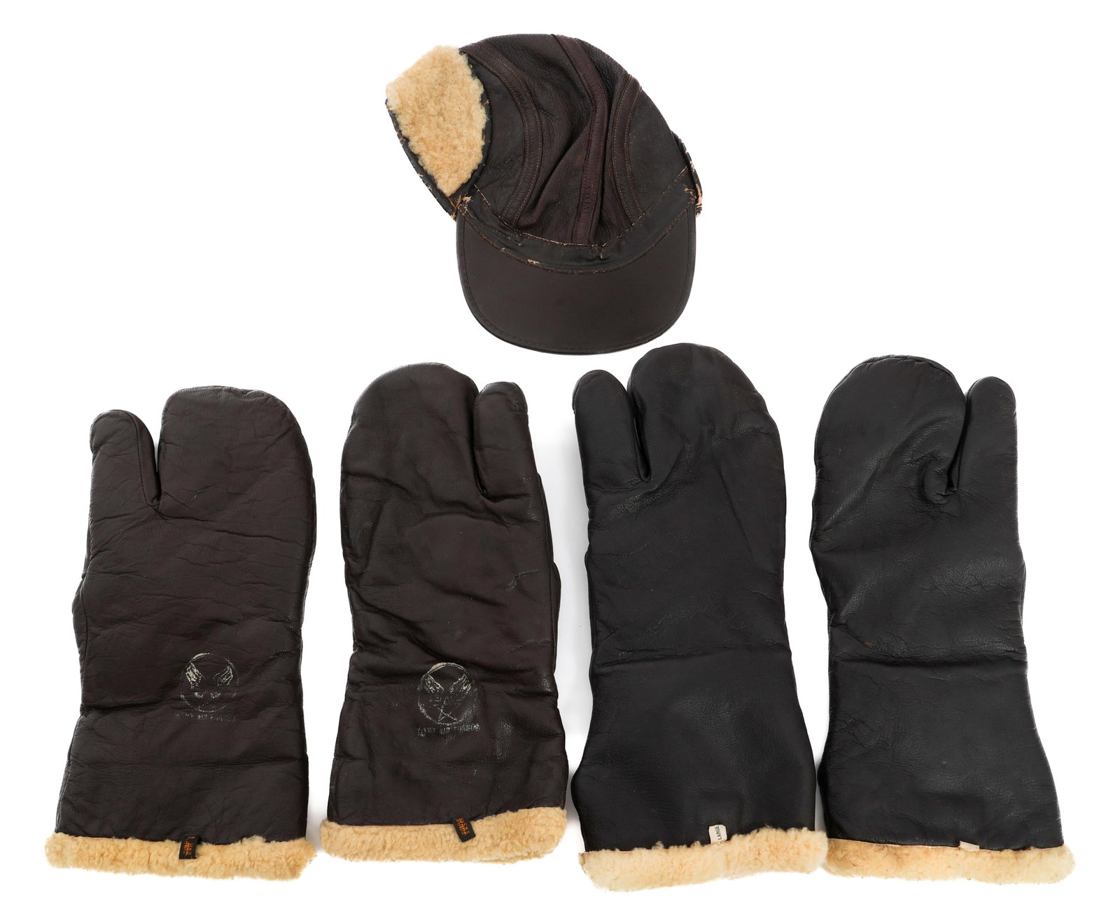 WWII USAAF GUNNER B-2 CAP & A-9 FLYING GLOVES: WWII USAAF GUNNER B-2 CAP & A-9 FLYING GLOVES WWII USAAF B-2 Flying Cap and A-9A Winter Flying Cap. (1) B-2 Cap. Leather construction with fur lining. No visible marks. (2) Pairs of Type A-9A Winter F