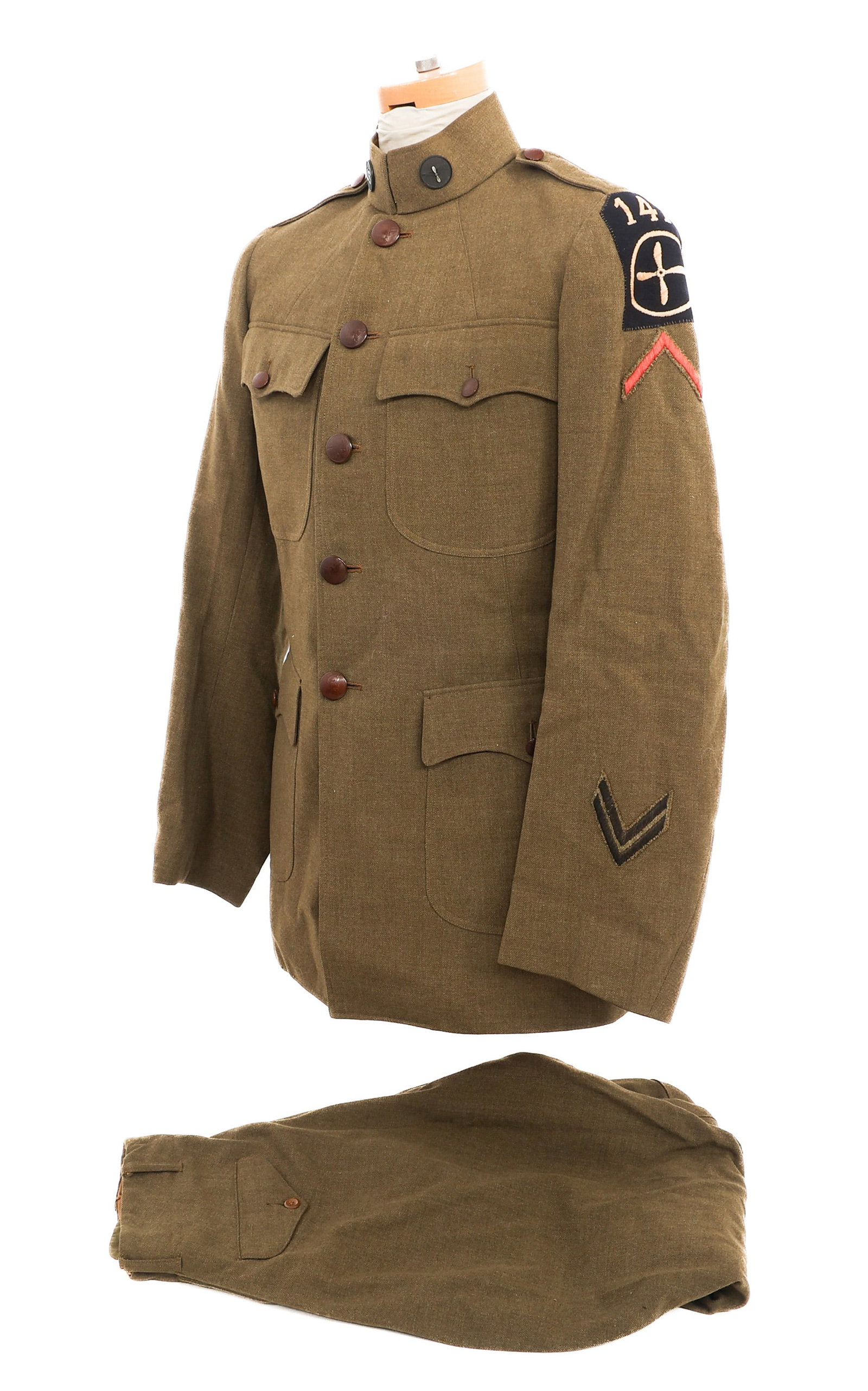 WWI US ARMY 147th AERO SQUADRON TUNIC: WWI US ARMY 147th AERO SQUADRON TUNIC WWI US Army 147th Aero Squadron Tunic. Olive drab wool service tunic with unit patch, overseas and discharge stripes. Tailor tag of Kahn present. Matching trouser