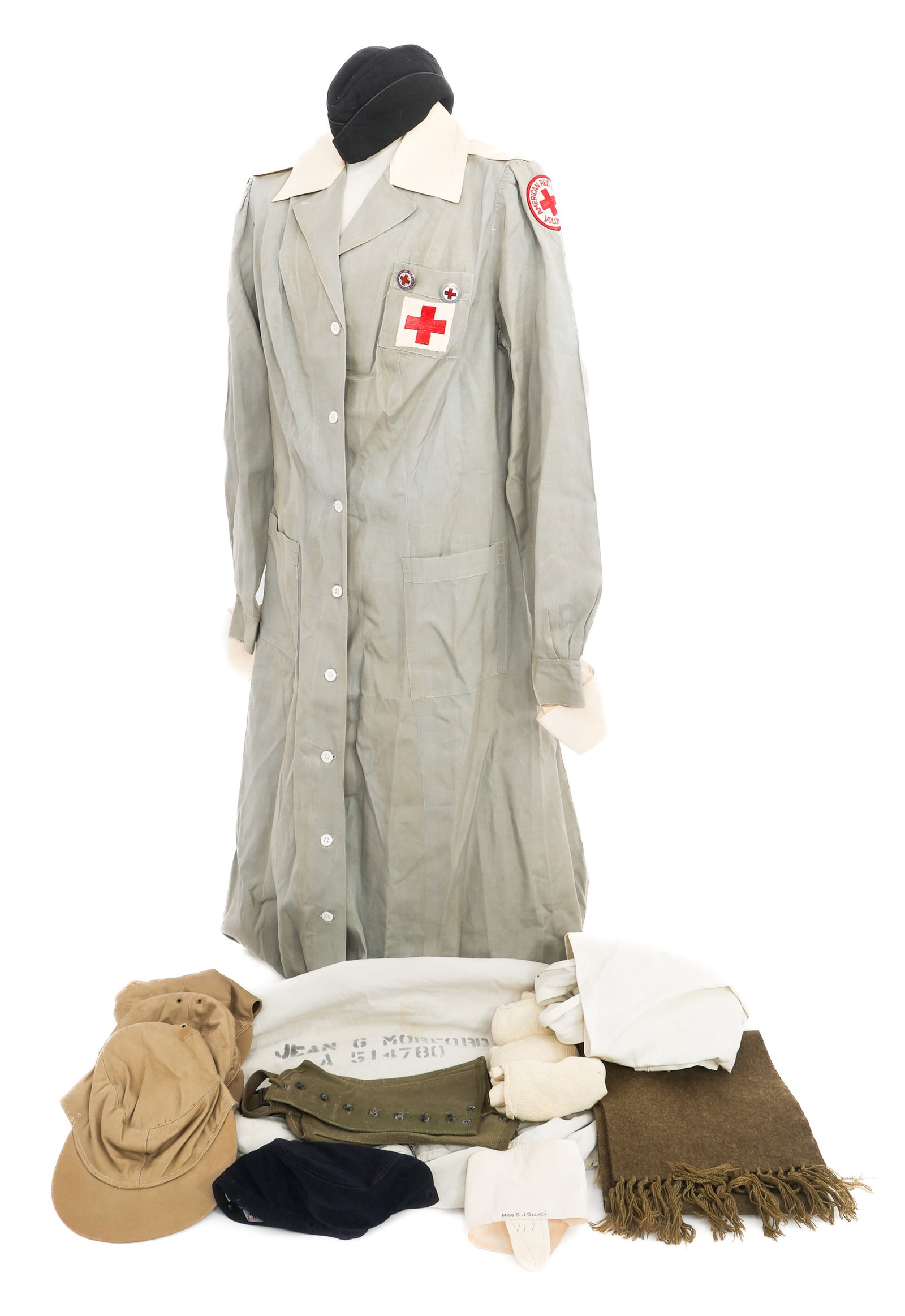 WWII US RED CROSS, WAAC & ARMY NURSE UNIFORM ITEMS: WWII US RED CROSS, WAAC & ARMY NURSE UNIFORM ITEMS WWII US Red Cross, WAAC and Army Nurse Uniform Items. Includes WAAC Caps, Red Cross gray dress, garrison cap, leggings, socks, scarf, laundry bag and