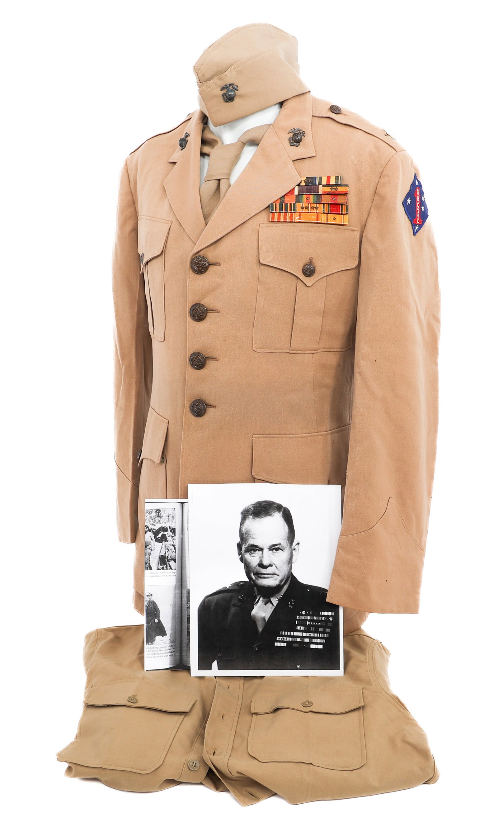 WWII USMC CHESTY PULLER TRIBUTE UNIFORM: WWII USMC CHESTY PULLER TRIBUTE UNIFORM WWII USMC Chesty Puller Tribute Grouping. (1) Garrison Cap. (1) Service Shirt. Includes Neck Tie. (1) Tunic. 1st Marine Division shoulder patch. Brigadier Gener