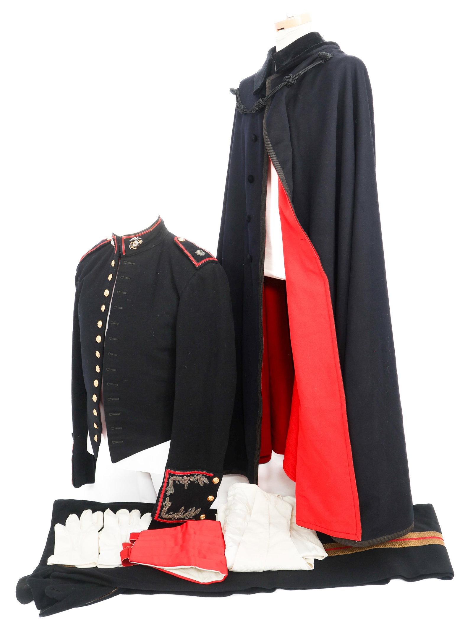 COLD WAR USMC MAJOR MESS DRESS UNIFORM & CLOAK: COLD WAR USMC MAJOR MESS DRESS UNIFORM & CLOAK Cold War US Marine Corps Major Mess Dress Uniform and Cloak. (1) Cloak. Cotton construction. Tailor tag of FJ Heiberger and Son present. (1) Dress Tunic.