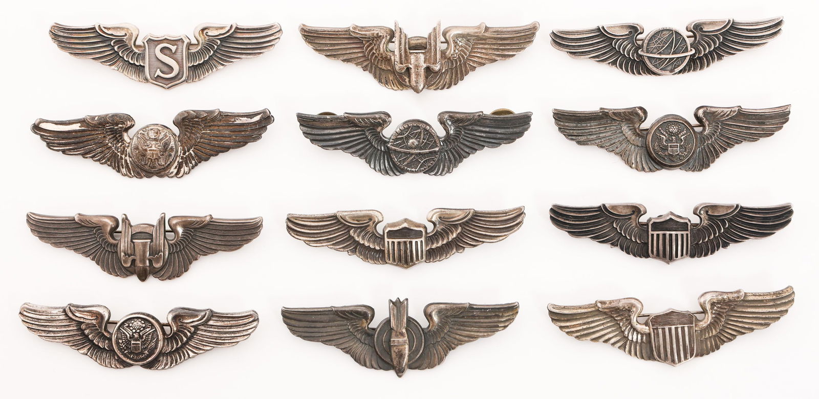WWII USAAF 3" QUALIFICATION WINGS: WWII USAAF 3" QUALIFICATION WINGS WWII USAAF Qualification Wings. Clutchback and pinback construction. All are marked Sterling. Makers include NS Meyer, Amico, Amcraft, LGB and Vanguard. (1) Bombardie