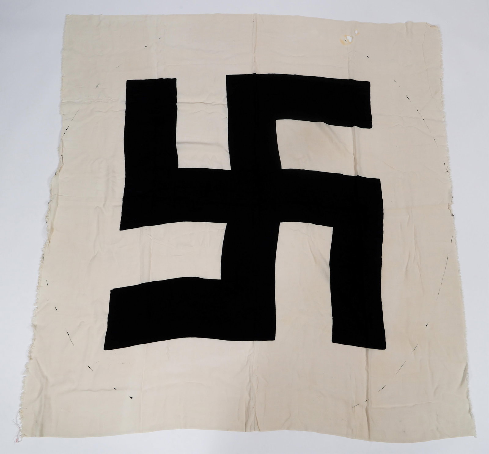 WWII GERMAN UNCUT CLOTH NSDAP FLAG EMBLEM: WWII GERMAN UNCUT CLOTH NSDAP FLAG EMBLEM WWII German Factory Uncut Cloth NSDAP Center Flag Emblem. One-piece cloth construction with printed mobile swastika. Size: 72" x 67"