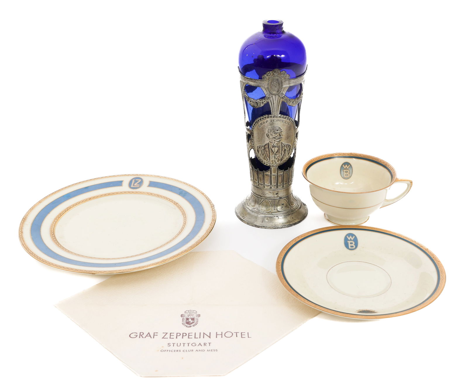 WWI - WWII GERMAN ZEPPELIN SERVEWARE & NAPKIN: WWI - WWII GERMAN ZEPPELIN SERVEWARE & NAPKIN WWI Imperial German Zeppelin Serveware & Napkin. Includes WB Zeppelin tea cup & plate by Heinerich & Co., Bavaria. LZ Graf Zeppelin plate by Heinerich & C