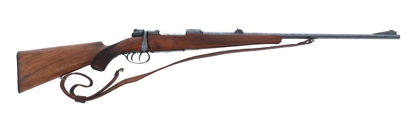 CUSTOM SPORTERIZED MAUSER 7mm CALIBER RIFLE: CUSTOM SPORTERIZED MAUSER 7mm CALIBER RIFLE Custom Sporterized Mauser 7mm caliber bolt action rifle. Bore measures 7mm. Blued finish. Engraved receiver. Blade front sight. Two position flip up rear si