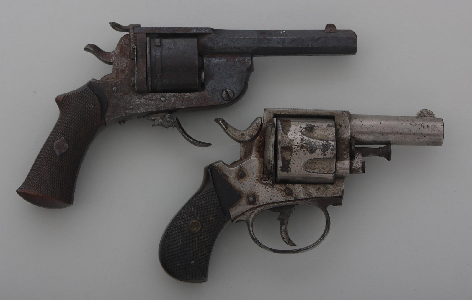 LIEGE AND FOREHAND & WADSWORTH REVOLVERS: LIEGE AND FOREHAND & WADSWORTH REVOLVERS Liege and Forehand & Wadsworth revolvers. A) Liege Levaux .32 caliber folding trigger top break double action revolver. Checkered wood grips. Six shot smooth c