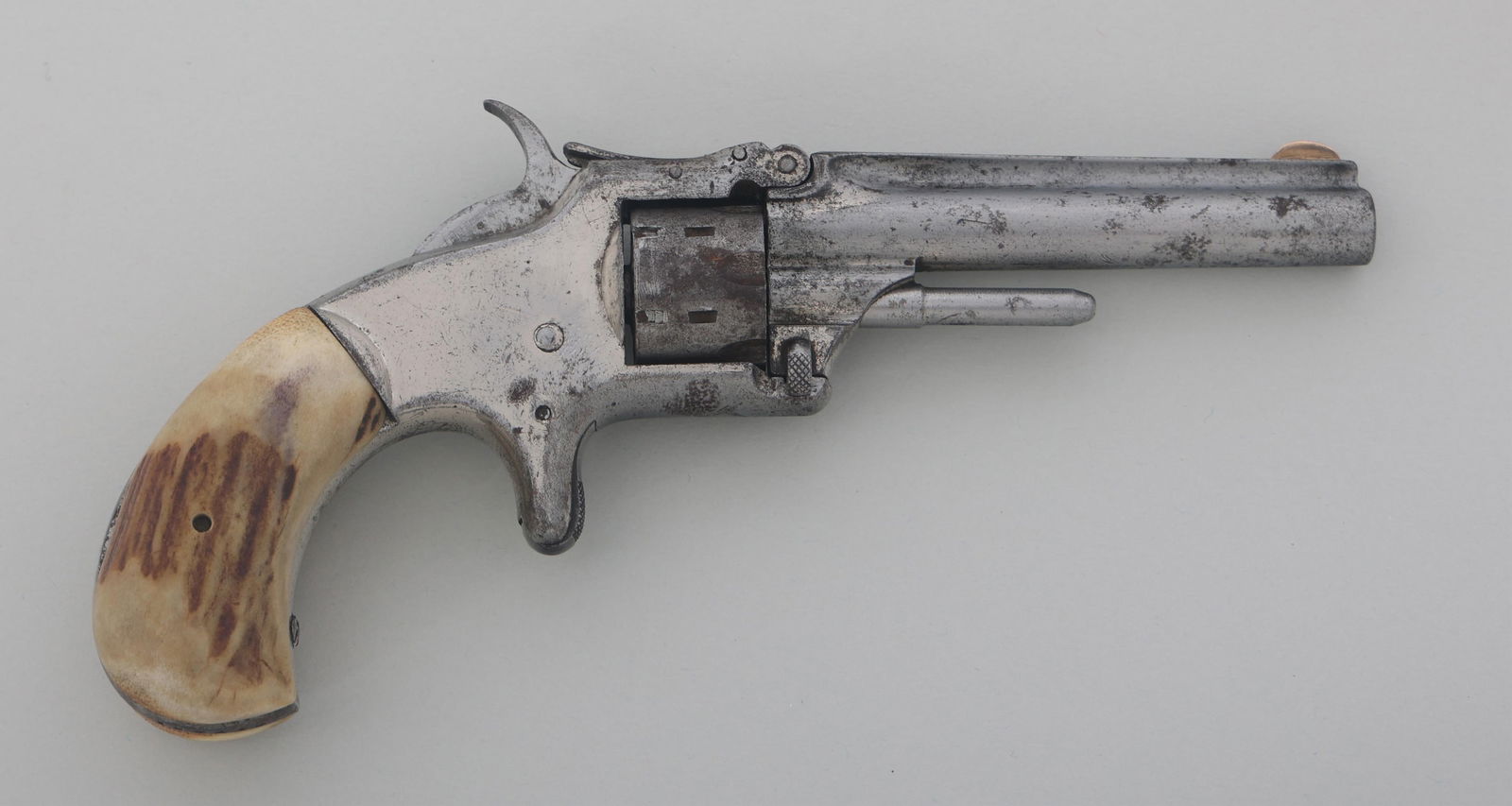 SMITH & WESSON MODEL 1 THIRD ISSUE .22 S REVOLVER: SMITH & WESSON MODEL 1 THIRD ISSUE .22 S REVOLVER Smith & Wesson Model 1 third issue .22 Short caliber tip up revolver. Wood grips. Fixed sights. Six shot fluted cylinder. Caliber / Gauge: 22 S Barrel