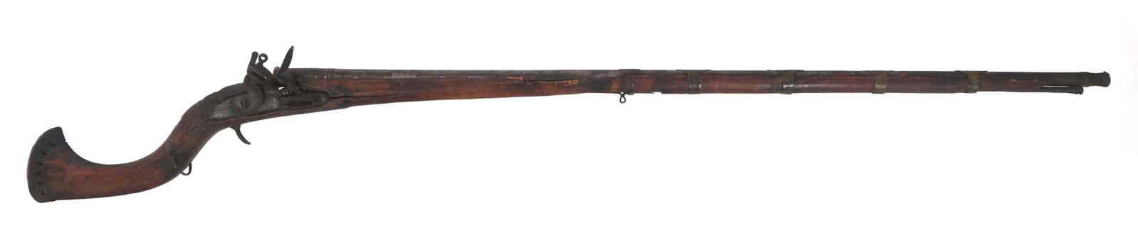 AFGHANI JEZAIL FLINTLOCK MUSKET: AFGHANI JEZAIL FLINTLOCK MUSKET Afghani Jezail flintlock musket. Crown over GR marked lock plate. Carved wood stock. Flared muzzle measures approximately .65 caliber. 46 inch barrel. 60 inches overall
