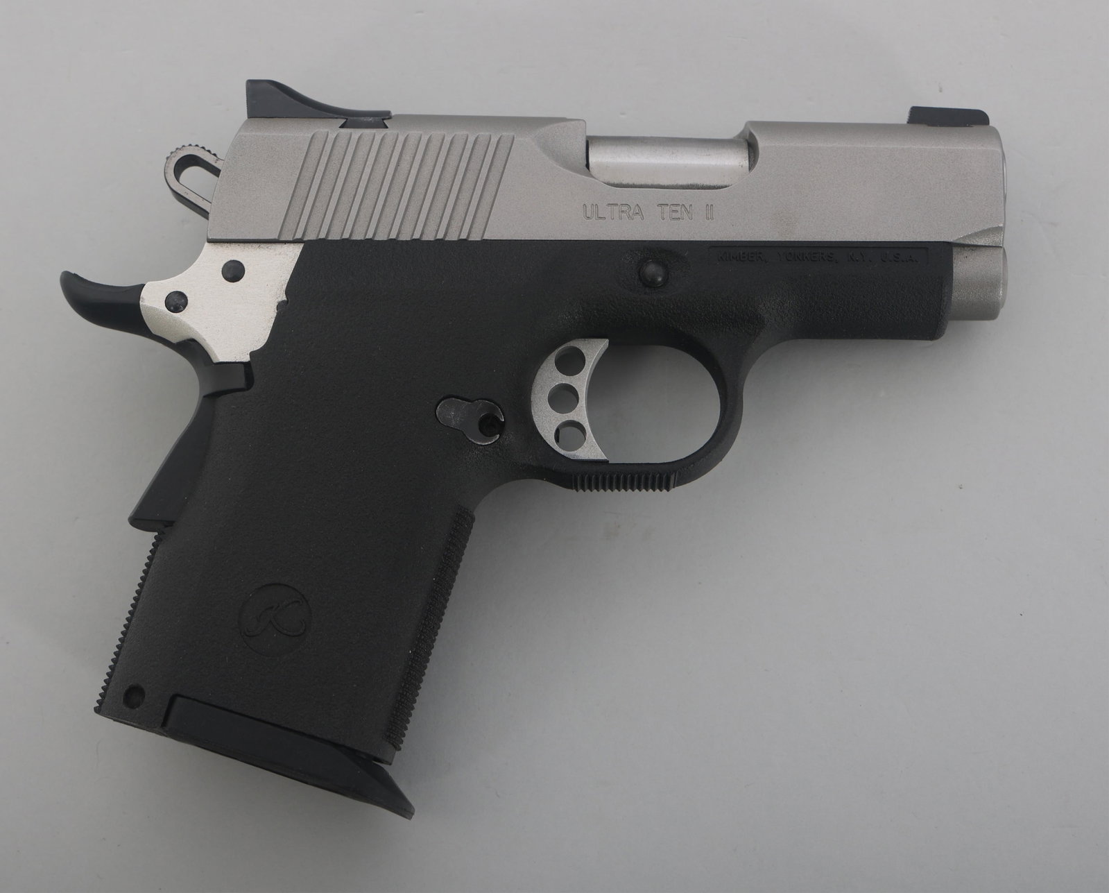 KIMBER MODEL ULTRA TEN II .45 ACP CALIBER PISTOL: KIMBER MODEL ULTRA TEN II .45 ACP CALIBER PISTOL Kimber Model Ultra Ten II .45 ACP caliber semi automatic pistol. Stainless steel finish. Polymer frame. Fixed sights. Manual. Gun lock. One magazine. P
