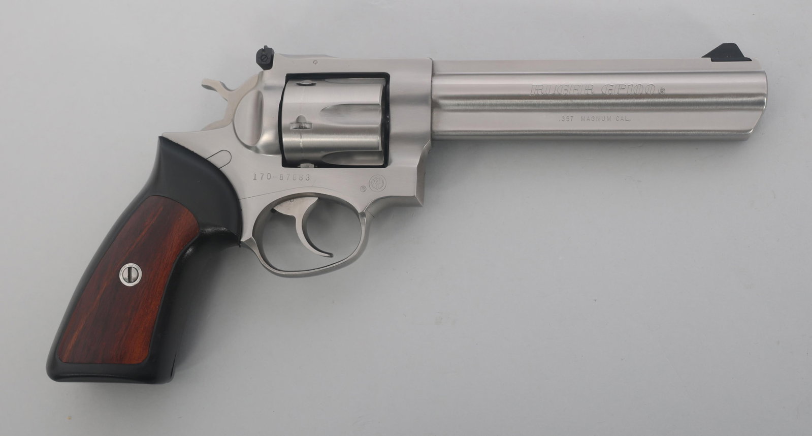 RUGER MODEL GP100 .357 MAGNUM CALIBER DA REVOLVER: RUGER MODEL GP100 .357 MAGNUM CALIBER DA REVOLVER Ruger Model GP100 .357 Magnum caliber DA revolver. Stainless steel finish. Rubber grips with wood insert. Adjustable rear sight. Full lug/Full rib bar
