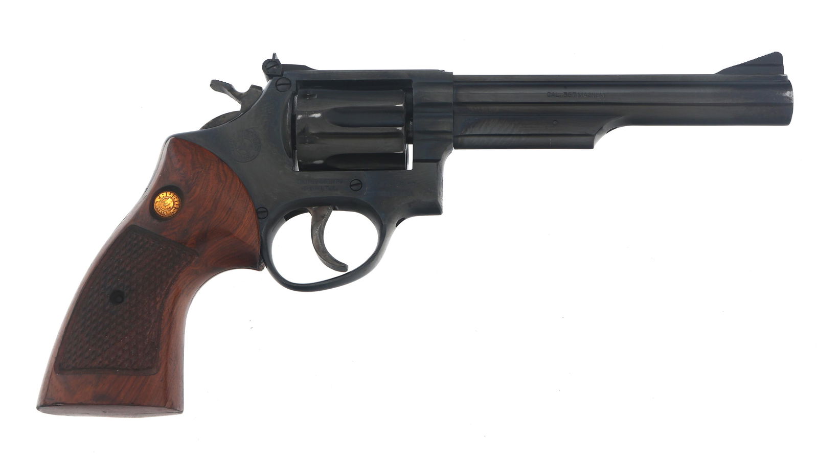 TAURUS MODEL 66 .357 MAGNUM CALIBER DA REVOLVER: TAURUS MODEL 66 .357 MAGNUM CALIBER DA REVOLVER Taurus Model 66 .357 MAG caliber double action revolver. Blued finish. Checkered wood grips with Taurus medallion. Adjustable rear sight. Six shot flute