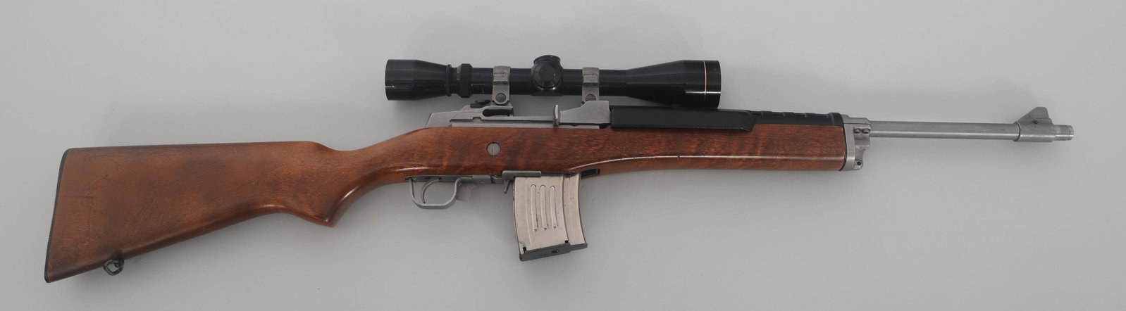 RUGER MODEL MINI 30 7.62mm CAL SEMI AUTO CARBINE: RUGER MODEL MINI 30 7.62mm CAL SEMI AUTO CARBINE Ruger Mini Thirty 7.62x39mm caliber semi automatic carbine. Matte stainless steel finish. Wood stock. Adjustable rear sight. One magazine. Leupold Vari