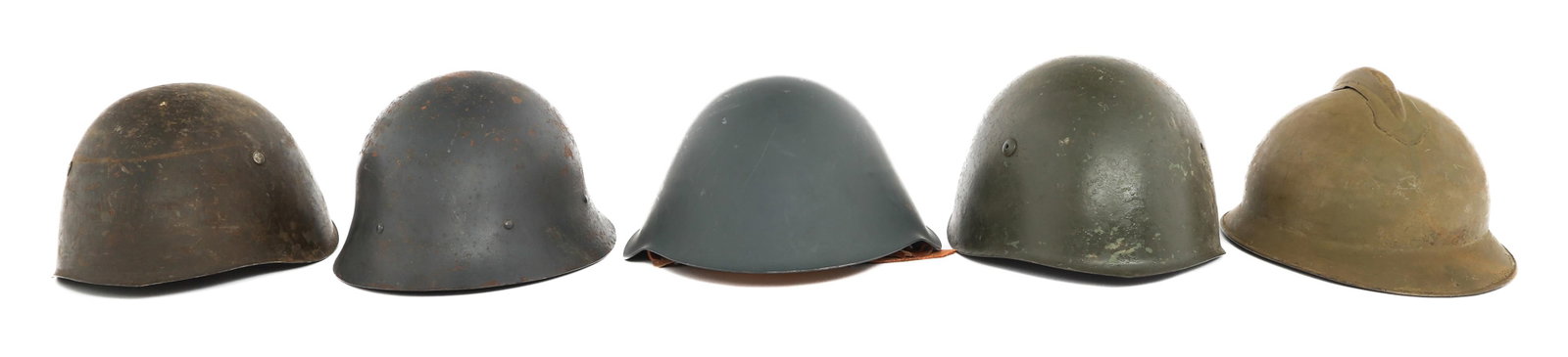 WWII - COLD WAR EUROPEAN MILITARY HELMETS: WWII - COLD WAR EUROPEAN MILITARY HELMETS WWII - Cold War European Military Helmets. (1) Italian M33. Liner present, chinstrap is missing. (1) Yugoslavian M33. No liner. USSR badge applied to the back