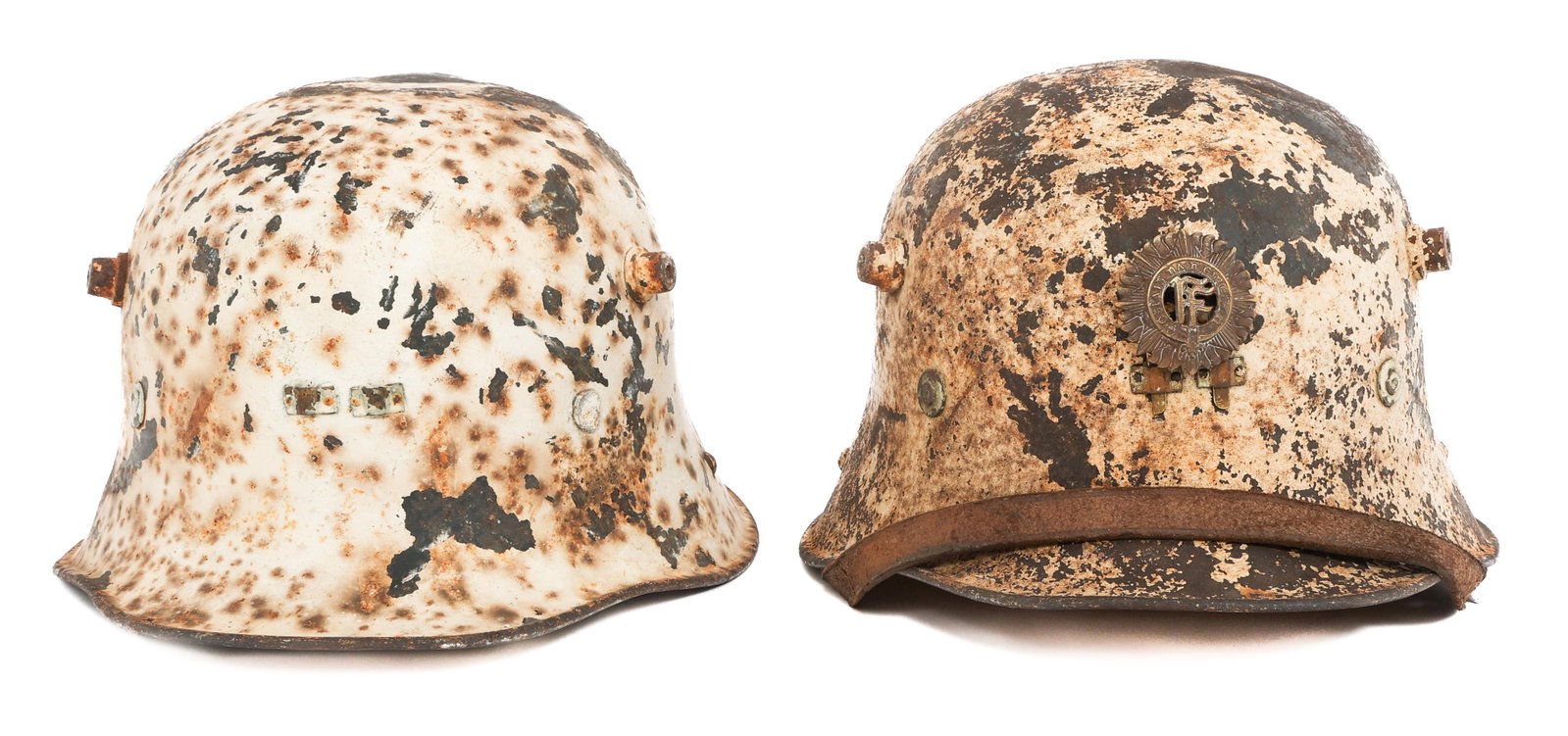 IRISH FREE STATE M27 VICKERS CIVIL DEFENSE HELMETS: IRISH FREE STATE M27 VICKERS CIVIL DEFENSE HELMETS Irish Free State M1927 Vickers Civil Defense Helmets. (1) M27. Includes original front badge. Serial numbered H8673. Liner and chinstrap present. (1)
