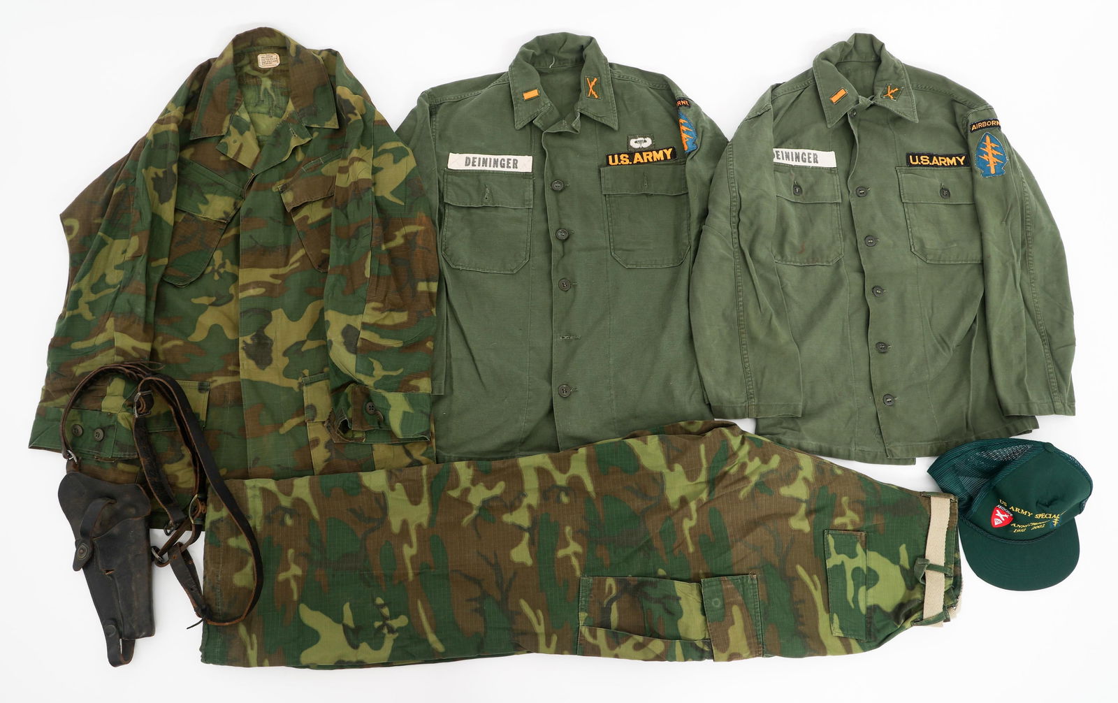 VIETNAM WAR US ARMY SPECIAL FORCES UNIFORMS: VIETNAM WAR US ARMY SPECIAL FORCES UNIFORMS Vietnam War US Army Special Forces Officer Uniforms & Pistol Holster. (2) OG-107 Utility Shirts with Special Forces shoulder patches, Infantry 2nd Lieutenan