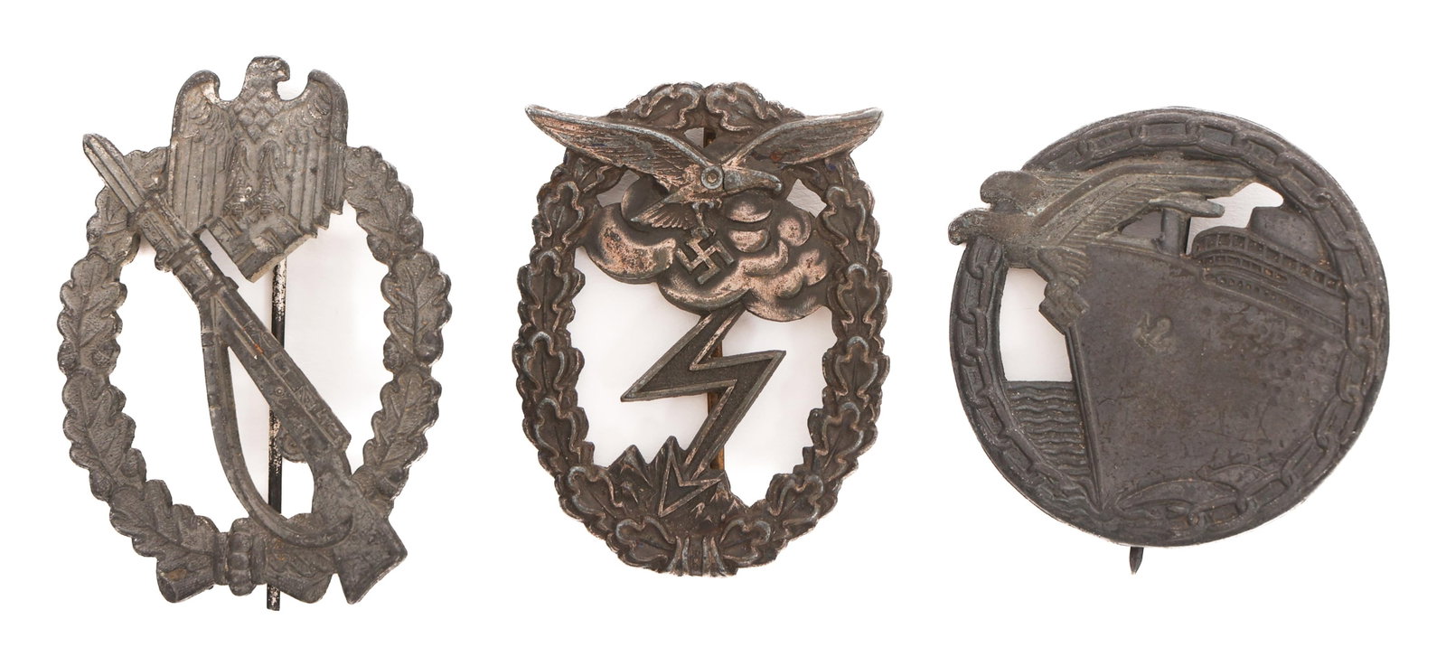 WWII GERMAN HEER, LUFTWAFFE & KRIEGSMARINE BADGES: WWII GERMAN HEER, LUFTWAFFE & KRIEGSMARINE BADGES WWII German Heer, Luftwaffe, & Kriegsmarine Badges. (1) Heer Silver Infantry Assault Badge. No visible maker marks. (1) Luftwaffe Ground Combat Badge.