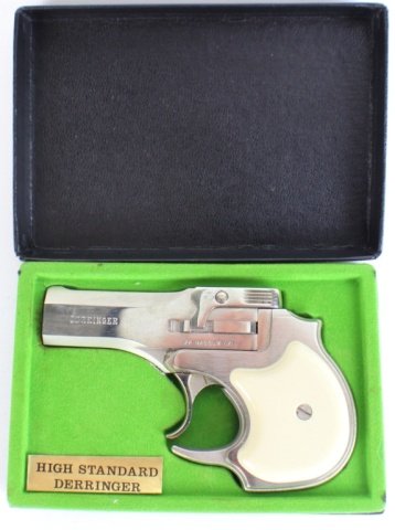 HIGH STANDARD DERRINGER .22 CAL MAGNUM: HIGH STANDARD DERRINGER .22 CAL MAGNUM High Standard .22 Cal Magnum derringer. Double over - under barreled break top action, allowed by a ridged lift release. Marked "DERRINGER" to left side of barre