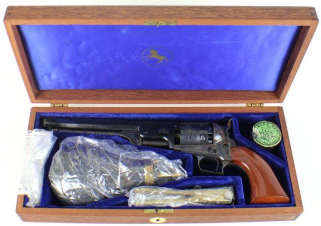 COLT SINGLE ACTION PERCUSSION REVOLVER: COLT SINGLE ACTION PERCUSSION REVOLVER Blackpowder Series Colt singe action percussion revolver with display case, powder flask, 250 colt caps, bullet mold and tool. Blued octogonal barrel and cylinde