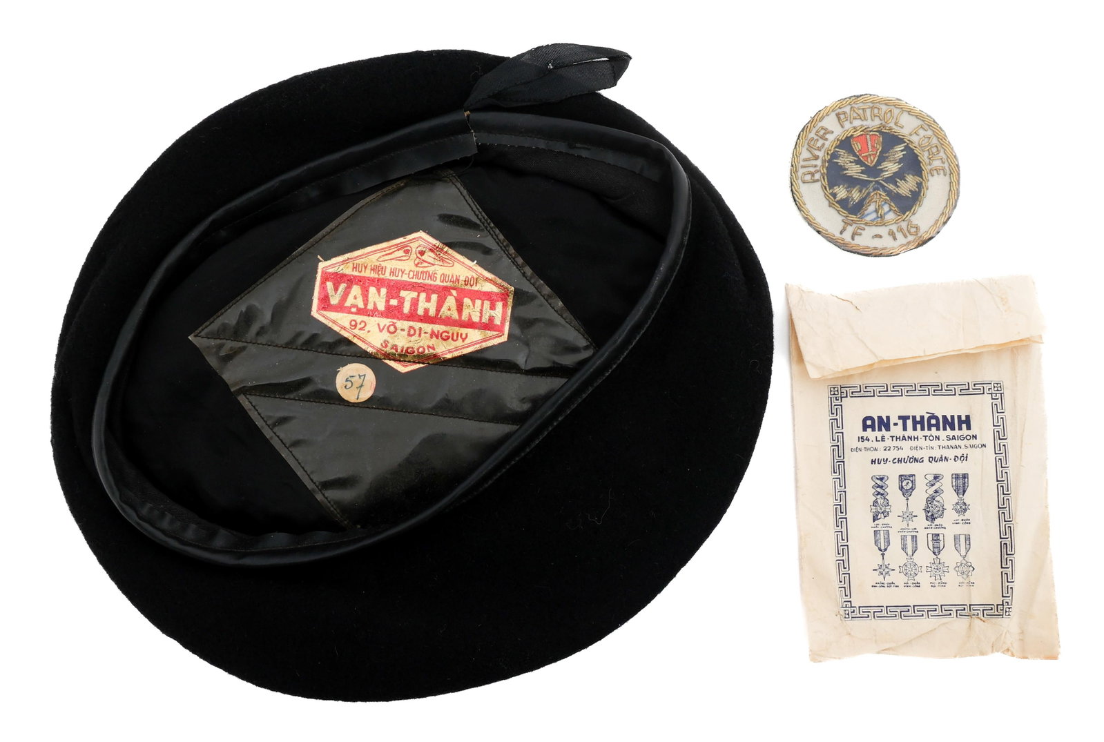 VIETNAM WAR USN RIVER PATROL FORCE TF 116 BERET: VIETNAM WAR USN RIVER PATROL FORCE TF 116 BERET Vietnam War US Navy River Patrol Force TF 116 Black Beret. Theater made, bullion stitched front badge. Saigon tailor tag present. Provenance: Lifetime M
