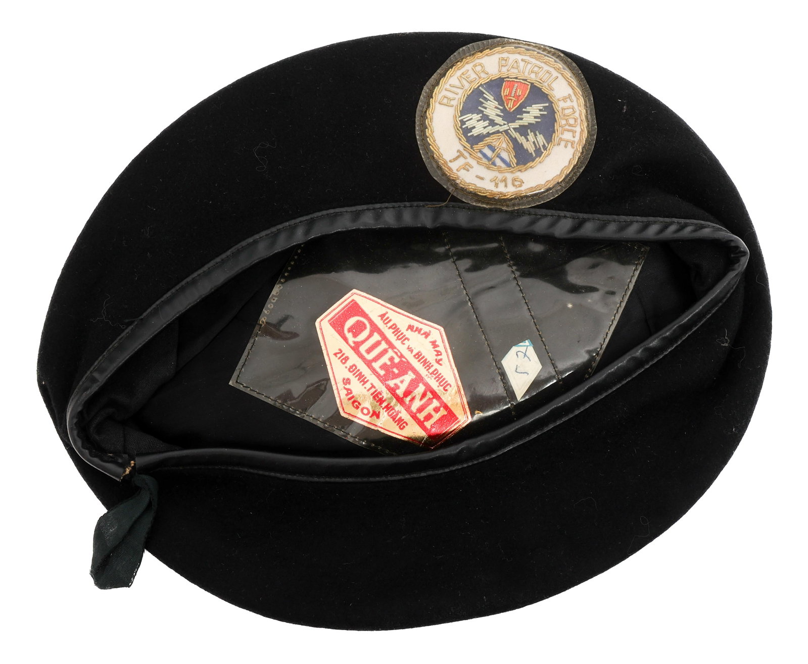 VIETNAM WAR USN RIVER PATROL FORCE TF 116 BERET: VIETNAM WAR USN RIVER PATROL FORCE TF 116 BERET Vietnam War US Navy River Patrol Force TF 116 Black Beret. Theater made, bullion stitched front badge. Saigon tailor tag present. Provenance: Lifetime M