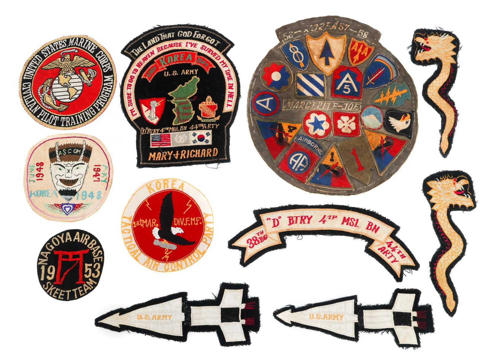 KOREAN WAR US ARMED FORCES JACKET PATCHES: KOREAN WAR US ARMED FORCES JACKET PATCHES Korean War US Armed Forces Jacket Patches. Includes USMC Tactical Air Control Party, 4th Missile Battalion, US Army missiles, dragon sleeve patches, Nagoya Ai