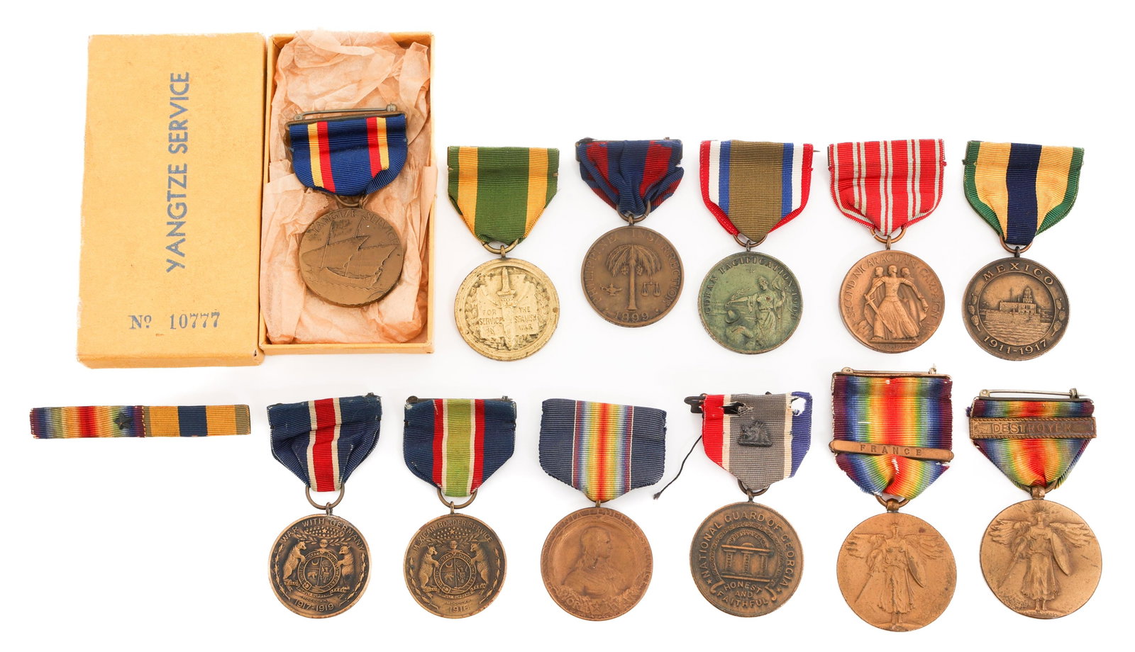 SPAN-AM WAR - WWI US CAMPAIGN & VICTORY MEDALS: SPAN-AM WAR - WWI US CAMPAIGN & VICTORY MEDALS Spanish American War - WWI US Campaign & Victory Medals. (1) USS Minneapolis Cuban Pacification Medal. Named to Bert H. Rotureau. Numbered 1271. (1) Yang
