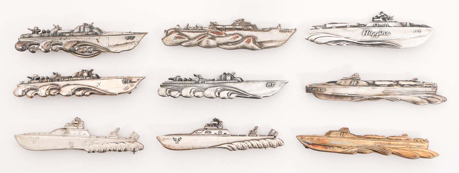 WWII - POST WAR NON-REG. US HIGGINS PT BOAT BADGES: WWII - POST WAR NON-REG. US HIGGINS PT BOAT BADGES WWII - Post War Non Regulation US Higgins Pt Boat Badges. (4) PT Badges. pinback and clasp closure. all are marked Sterling. (3) PT-450 Badges. One i